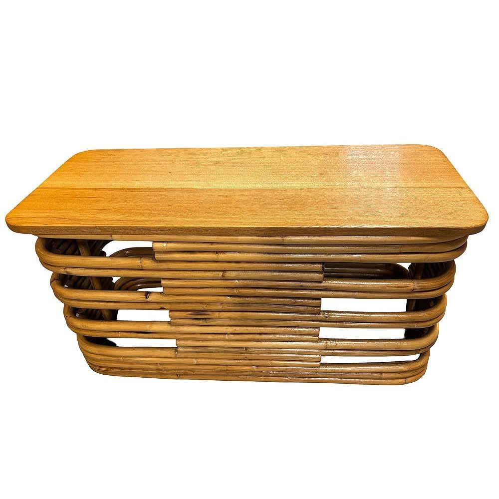 This beautifully restored stacked rattan and mahogany side drinks blends vintage charm with modern comfort. It features a light-stained mahogany top on a stacked rattan base with openings along the corners of the table. It offers a warm, organic