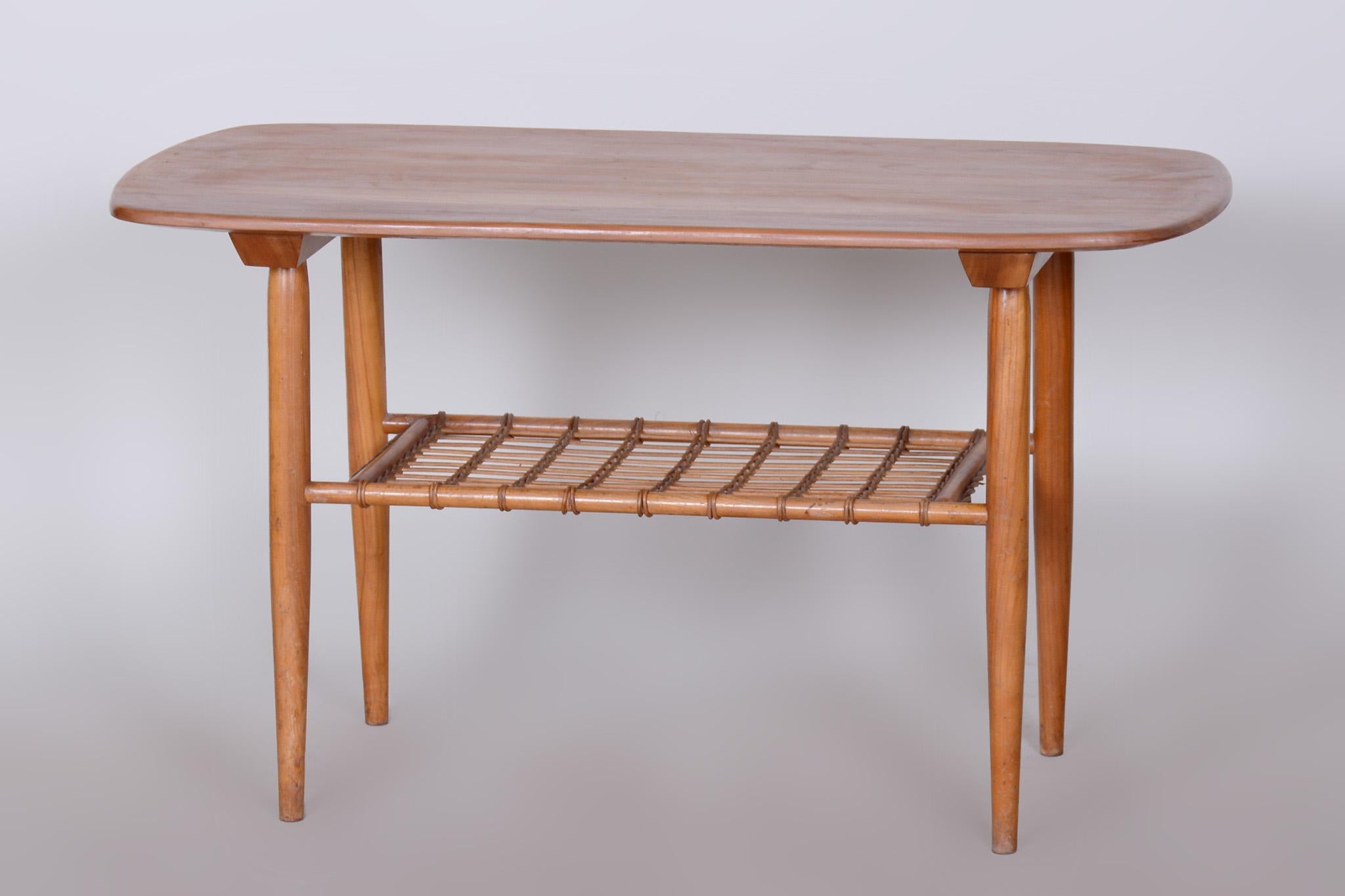 Restored midcentury style coffee table

Period: 1950-1959
Source: Czechia
Material: Cherry-Tree, rattan

Stable solid cherry wood construction with rattan.
Revived polish.