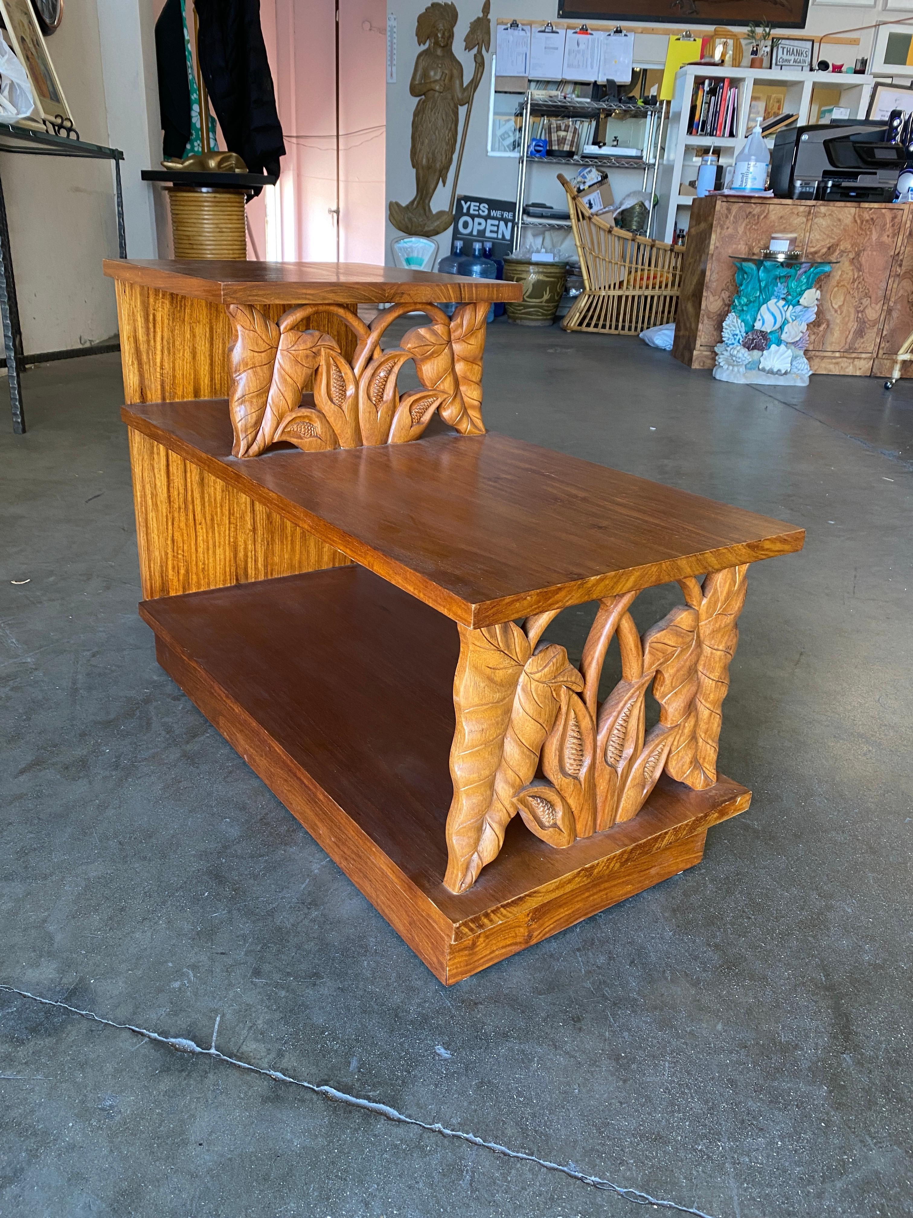 Midcentury three-tier mahogany side table with hand-carved bamboo pattern accenting the front and side. 

Side: 21