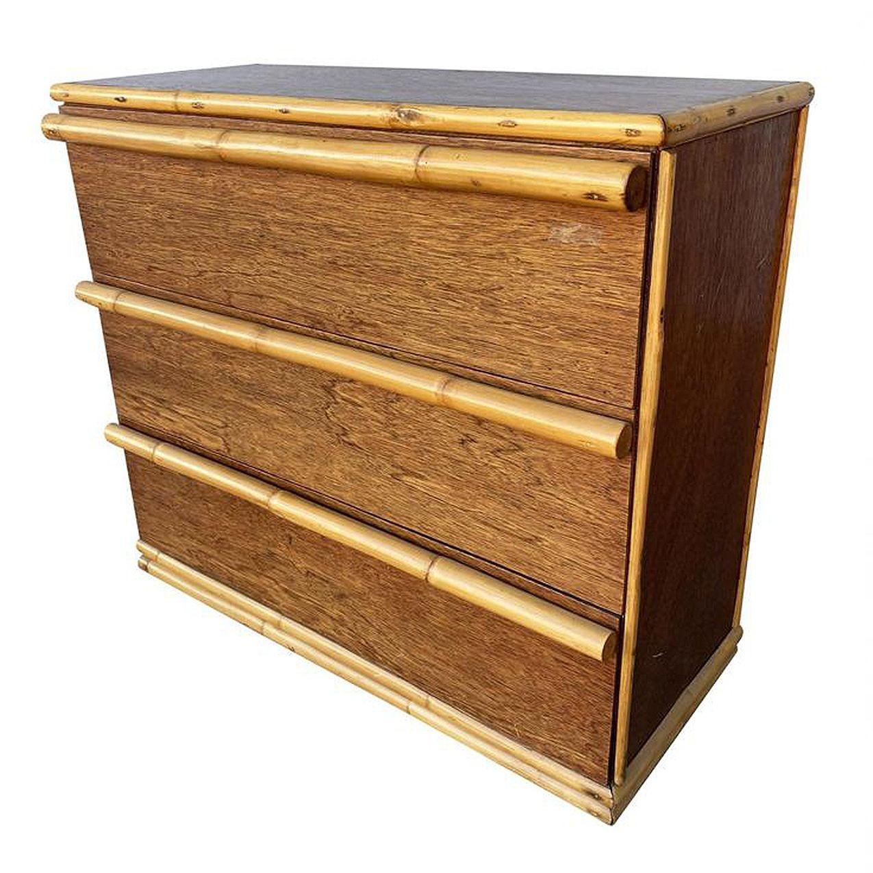 Restored Post War mahogany lowboy dresser with large full-length rattan pulls along each drawer and stacked rattan base.
1950, United States
Restored to new for you.
We only purchase and sell only the best and finest rattan furniture made by the