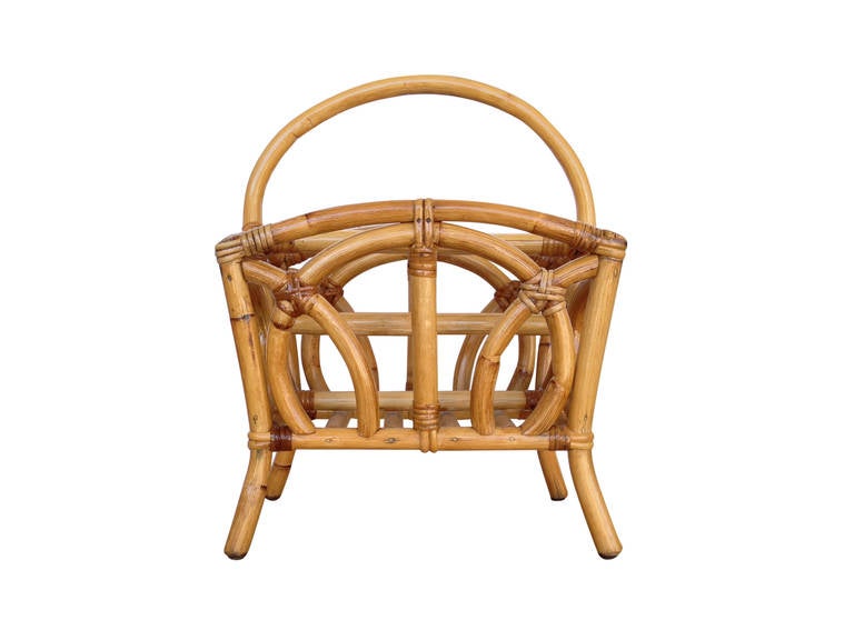Early circa 1940 molded pole rattan Magazine Rack. Great example of early modern rattan design.

Restored to new for you.

All rattan, bamboo and wicker furniture has been painstakingly refurbished to the highest standards with the best