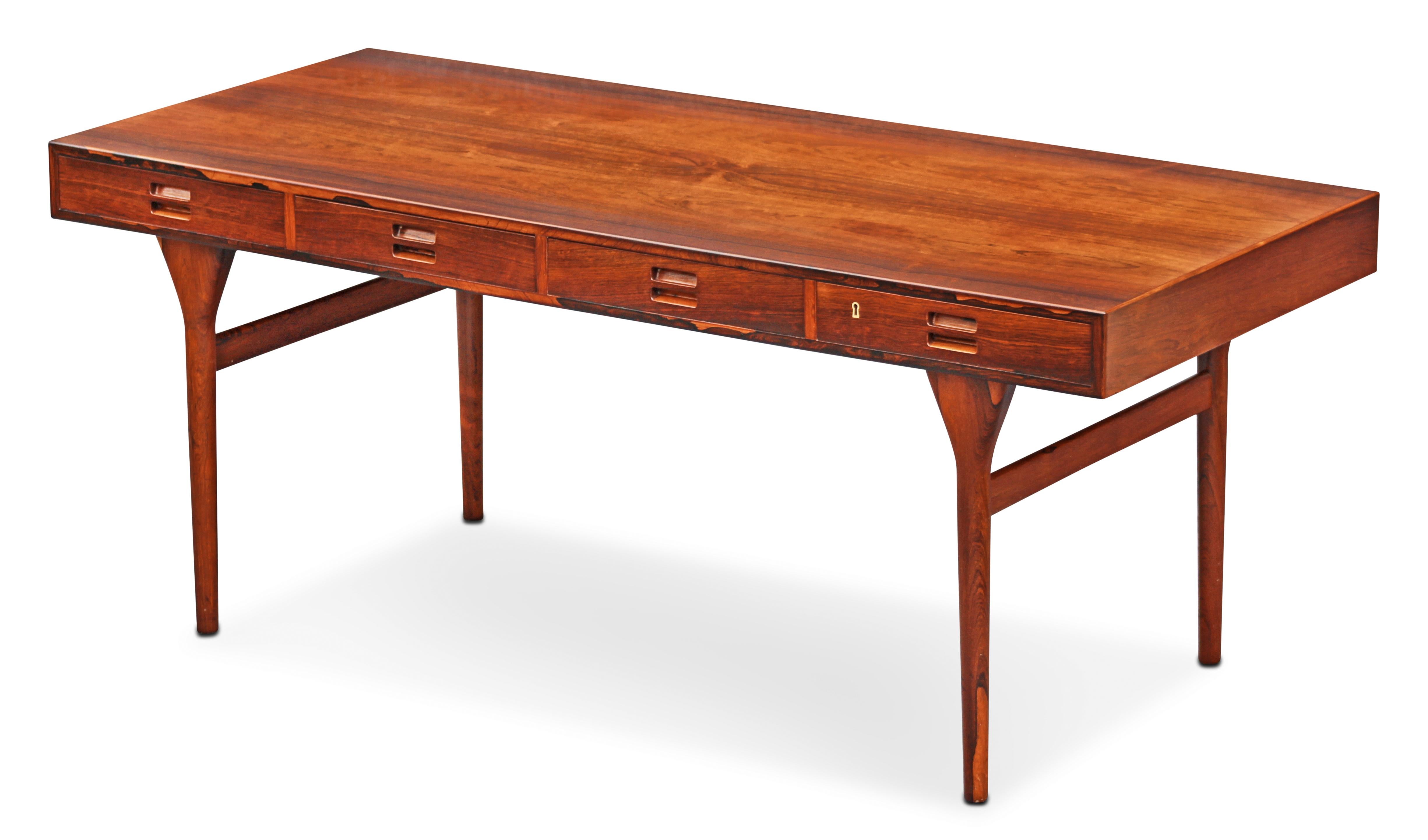 This desk was designed in the early 1950s by esteemed designer Nanna Ditzel for production by Søren Willadsen. Ditzel studied design at the Royal Danish Academy of Fine Arts with other iconic designers such as Victor Isbrand and Peter Hvidt, with