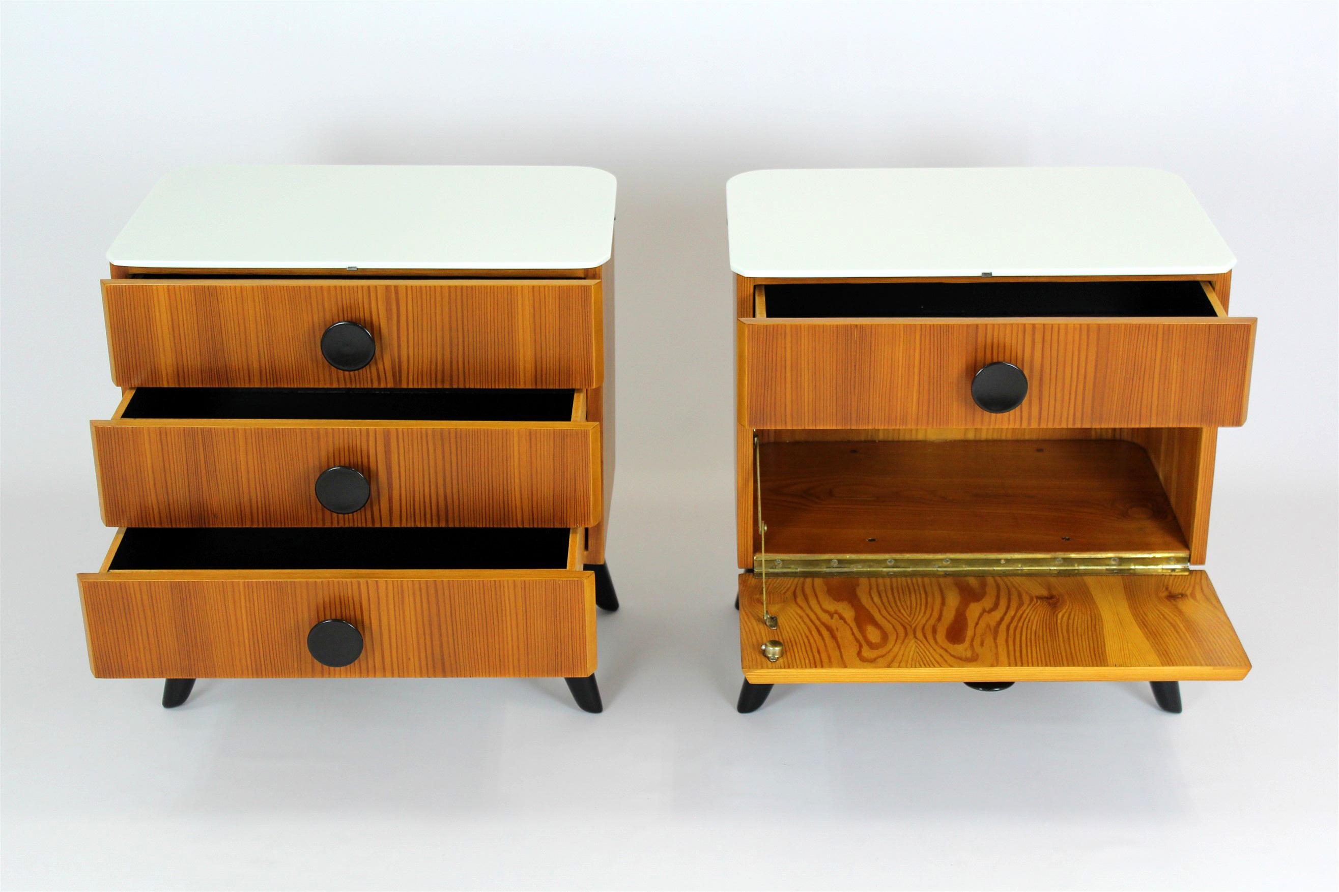 A pair of bedside tables designed by Jindrich Halabala. Produced by UP Zavody in Czechoslovakia in the 1950s.
The bedside tables have been fully restored, lacquered in a satin finish. Original white glass tops (with minor scratches).
    