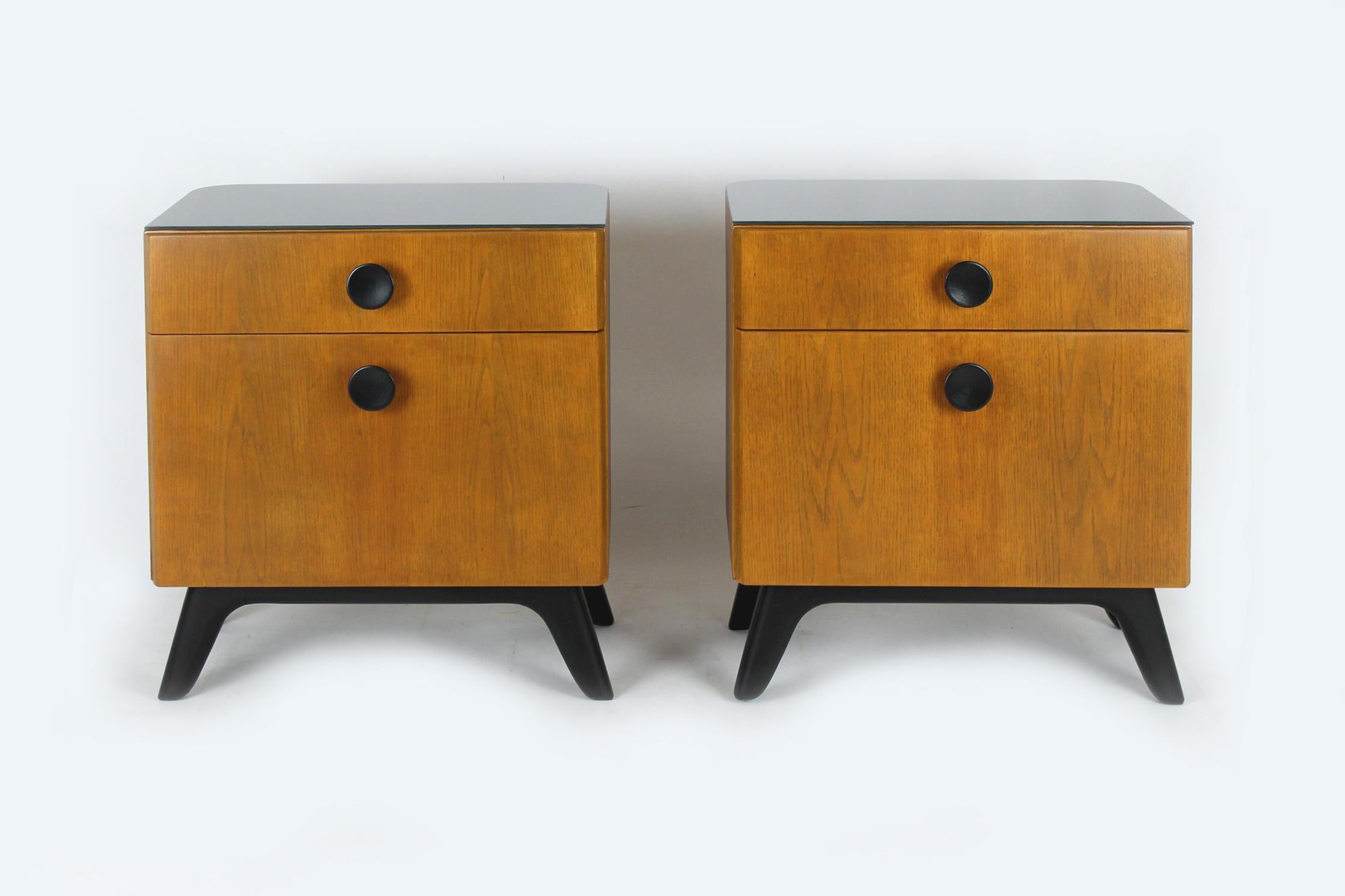 
A pair of bedside tables designed by Jindrich Halabala. Produced by UP Zavody in Czechoslovakia in the 1950s.
The bedside tables have been fully restored, lacquered in a satin finish, new glass tops.