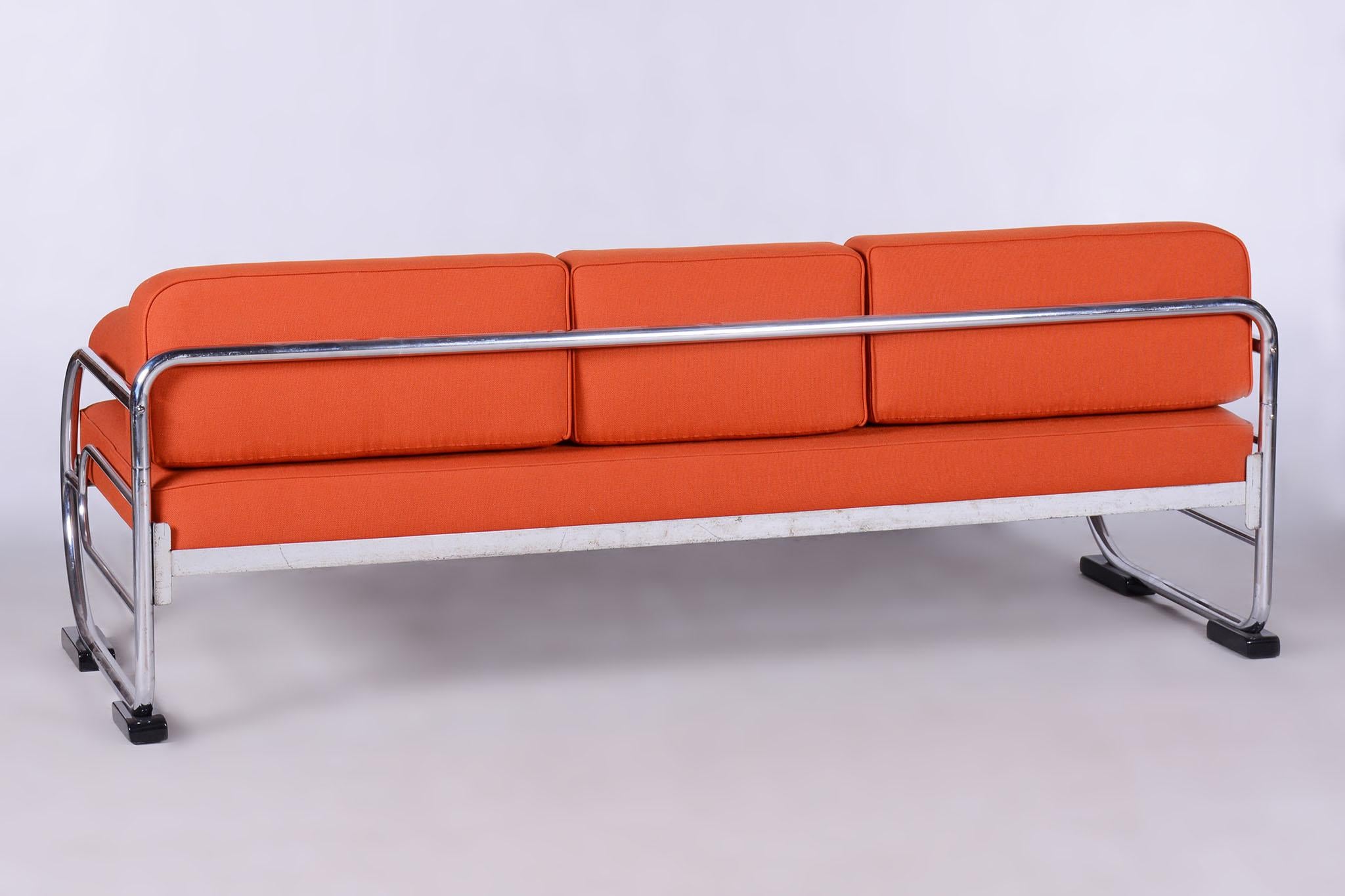 Restored Orange bauhaus sofa by Robert Slezak

Source: Czechia (Czechoslovakia)
Period: 1930-1939
Number of Seats: 3
Material: Chrome-Plated Steel, High-Quality Leather

Designed by renowned Czech designer Robert Slezak. 

It has been fully
