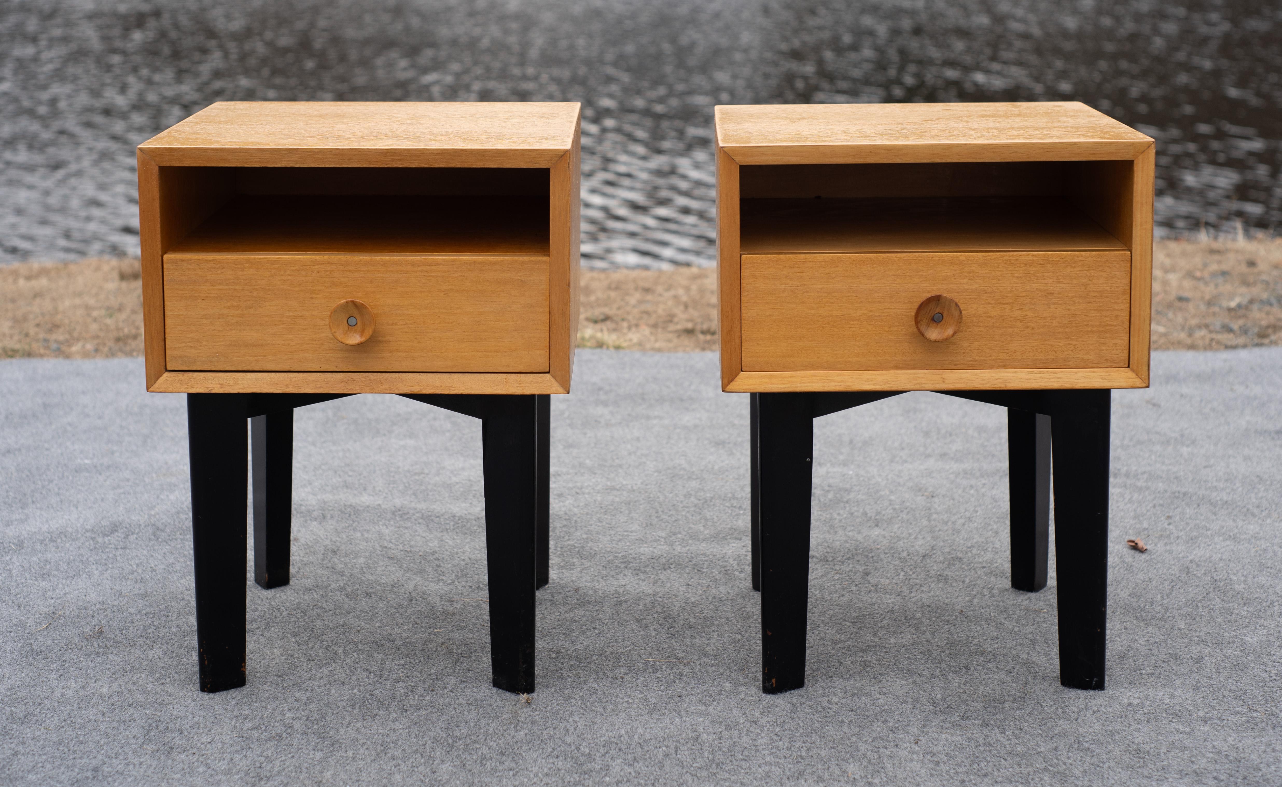 Rare pair of nightstands or end tables made by Herman Miller in the early 1950s and designed by American design icon George Nelson. Each nightstand features primavera construction, a form of bleached mahogany that takes on the color of golden maple
