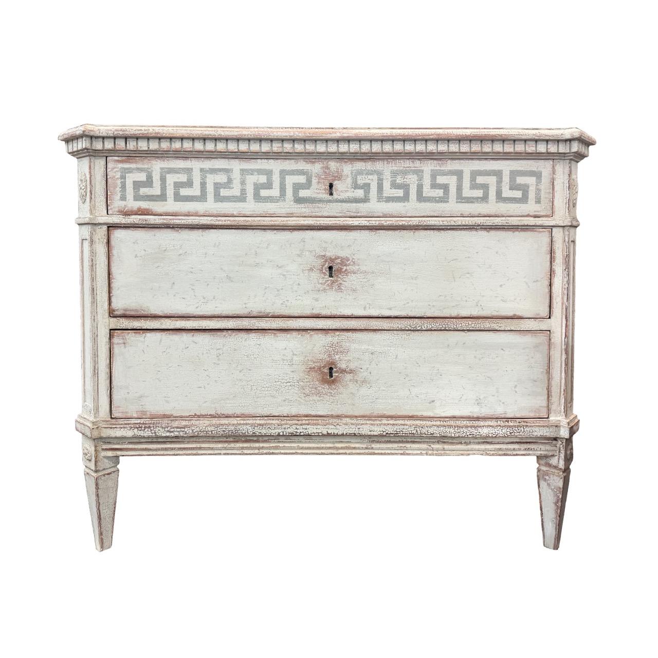 A beautifully restored pair of early to mid-20th Century Swedish Gustavian commodes, meticulously hand-crafted in painted Pinewood. These refined Scandinavian chests are characteristic of the Gustavian revival period, echoing the restrained