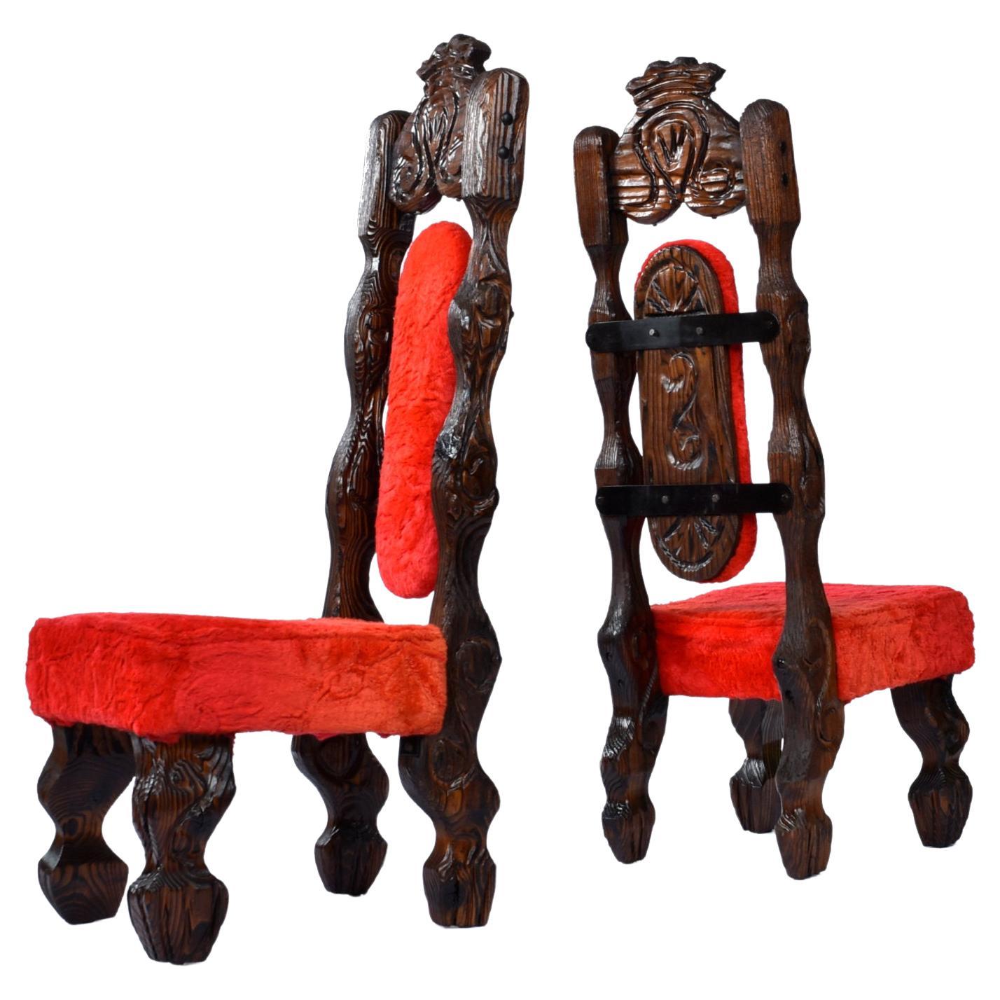 Pair of restored Witco Conquistador tiki dramatic high-back chairs in original red fur. These chairs are absolutely wild in the best kind of way. The original red fur fabric has a thick pile. This bright red upholstery adds drama to the high-back,
