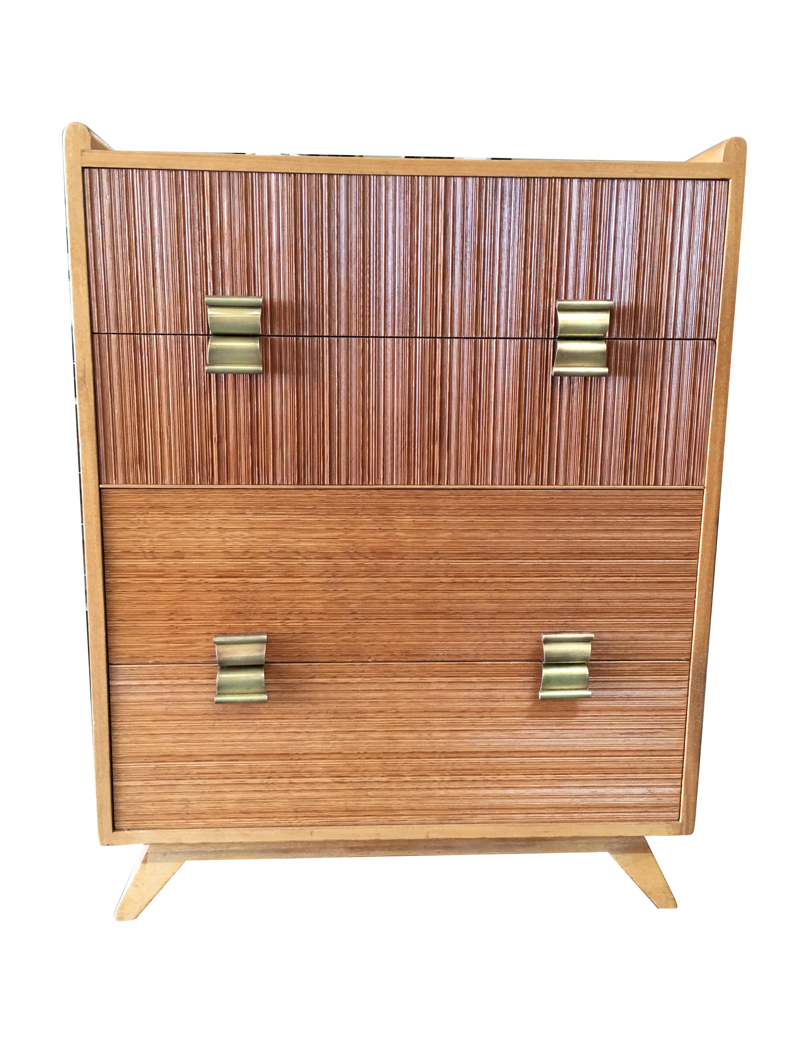 Mid Century chest of drawers by Paul Frankl for the Brown Saltman company features his trademark combed wood sides with curled brass pulls.