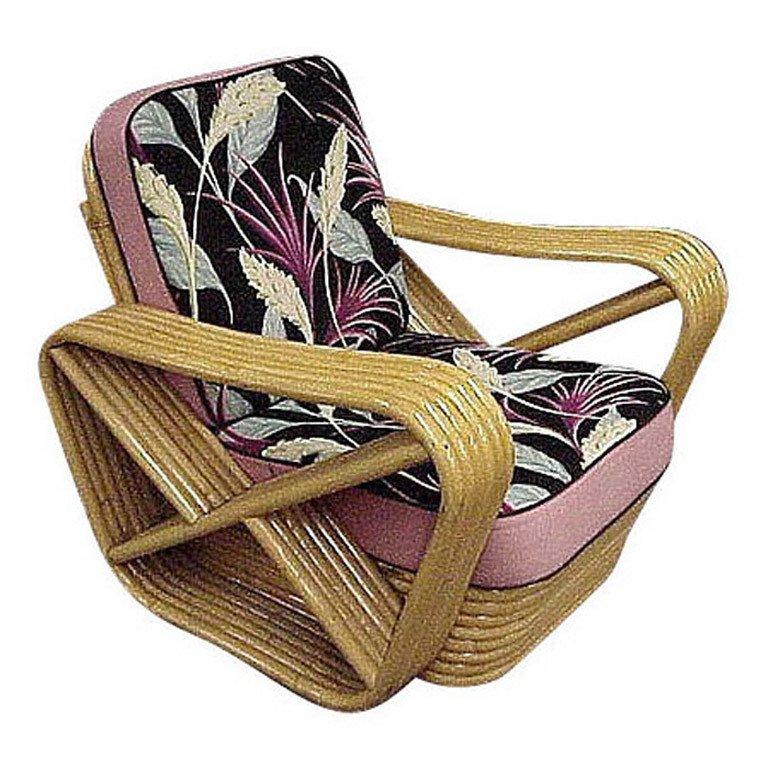 This six-strand, rattan lounge chair features square pretzel arms and a Classic stacked base.

Restored to new for you.

This was made by Ritts co, Tropitan , Herb Sr. and Shirley Ritts. Shirley was an American interior designer, furniture designer,