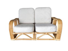 Restauriertes Paul Laszlo-Rattan-Sofa mit viersträngigen Unterteilten