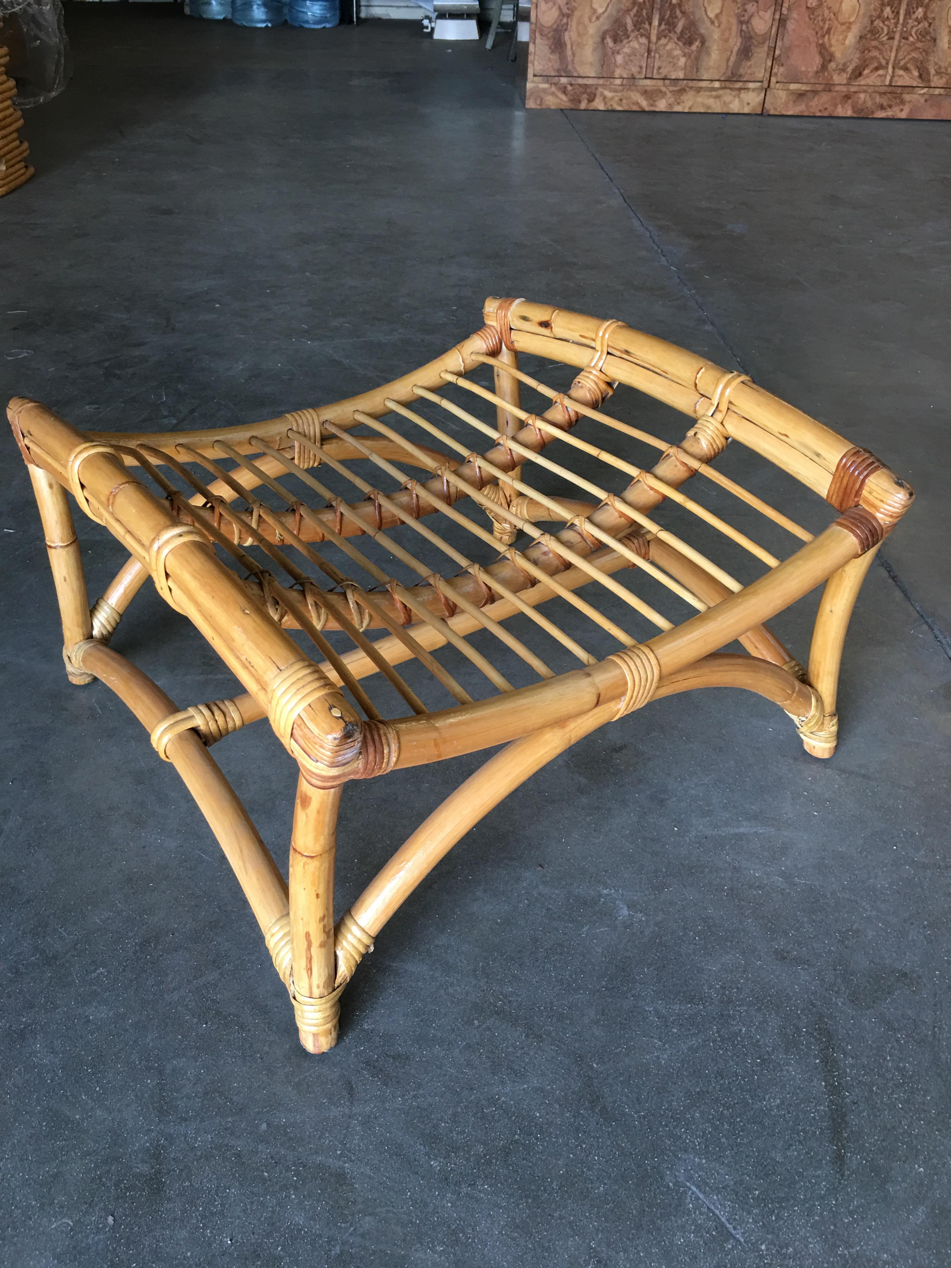 Two-strand slope seat rattan lounge chair with matching ottoman. The chair arms featuring 2 full rattan pole bent into an arch with a decorative center stick rattan piece. The seat features a rare heavy slope for easy full reclining.
Circa