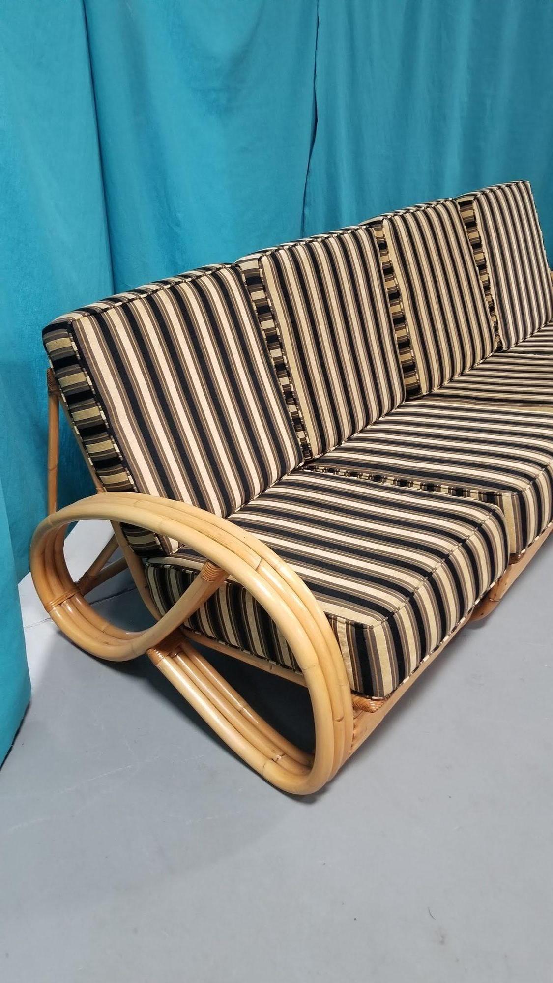 2-piece living room set of restored rattan furniture. A 3/4 pretzel arm sofa that is made up of 3 pieces and 3 seats and has a stacked rattan base, and a 3/4 pretzel adjustable lounge chair.

Couch: 32