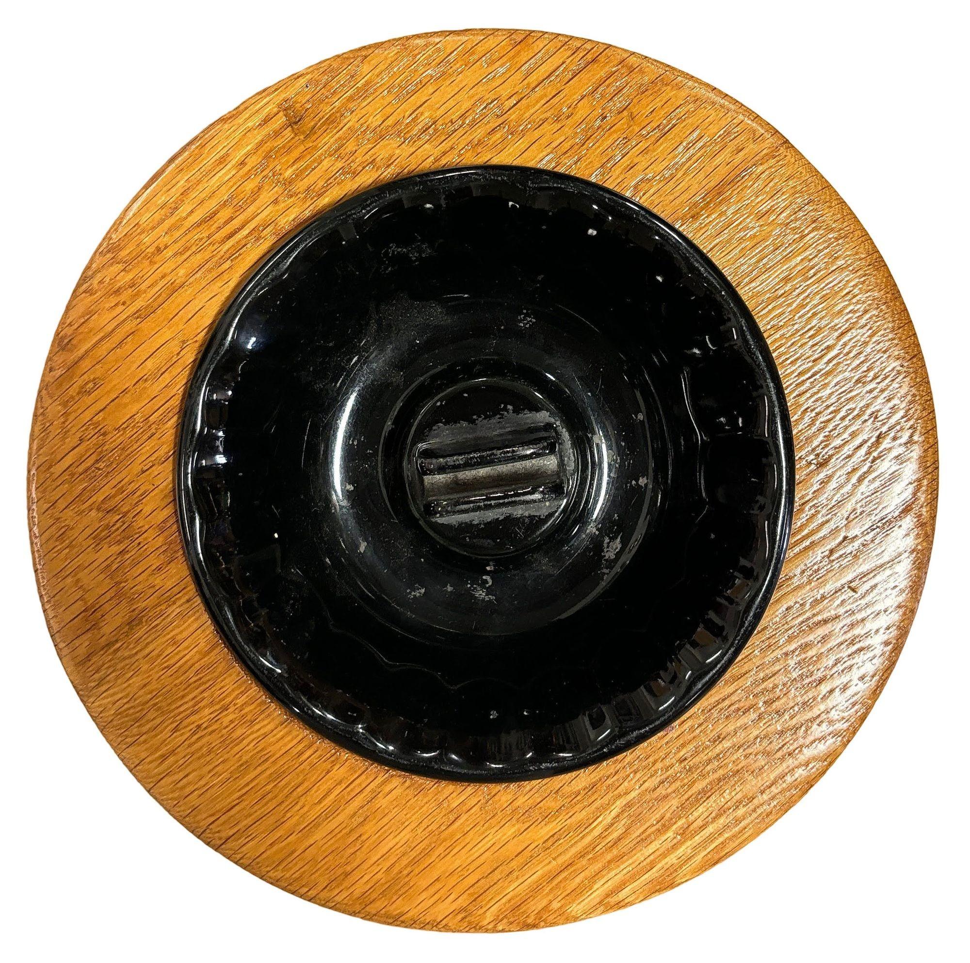 This beautifully restored Paul Frankl-inspired standing rattan ashtray is a sleek and functional accessory designed for convenience and style. Typically featuring a tall, slender base with a bowl or tray at the top, it serves as a hands-free