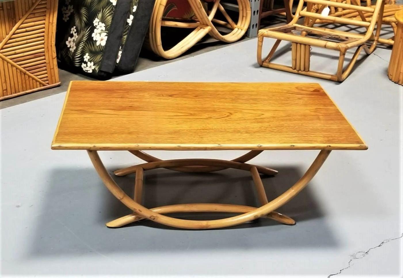 Mid-Century Modern Restored Rattan Coffee Table with Arched Bridge Legs and a Mahogany Top For Sale