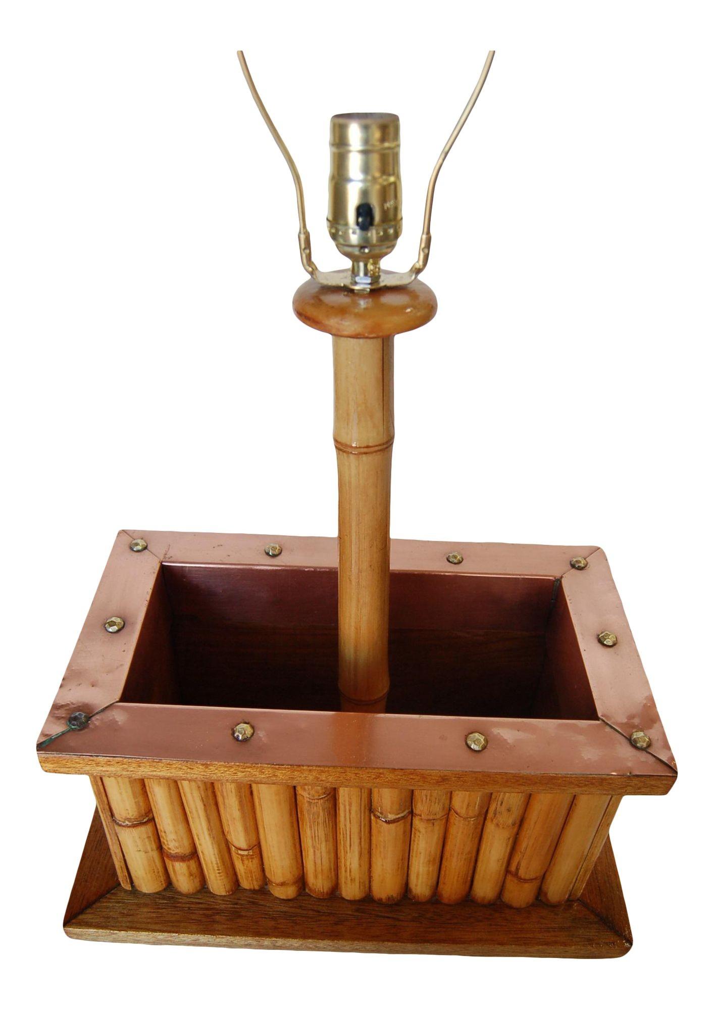 Restored Mid-Century rattan table lamp featuring a copper planter in the center, circa 1950.

Measures 20