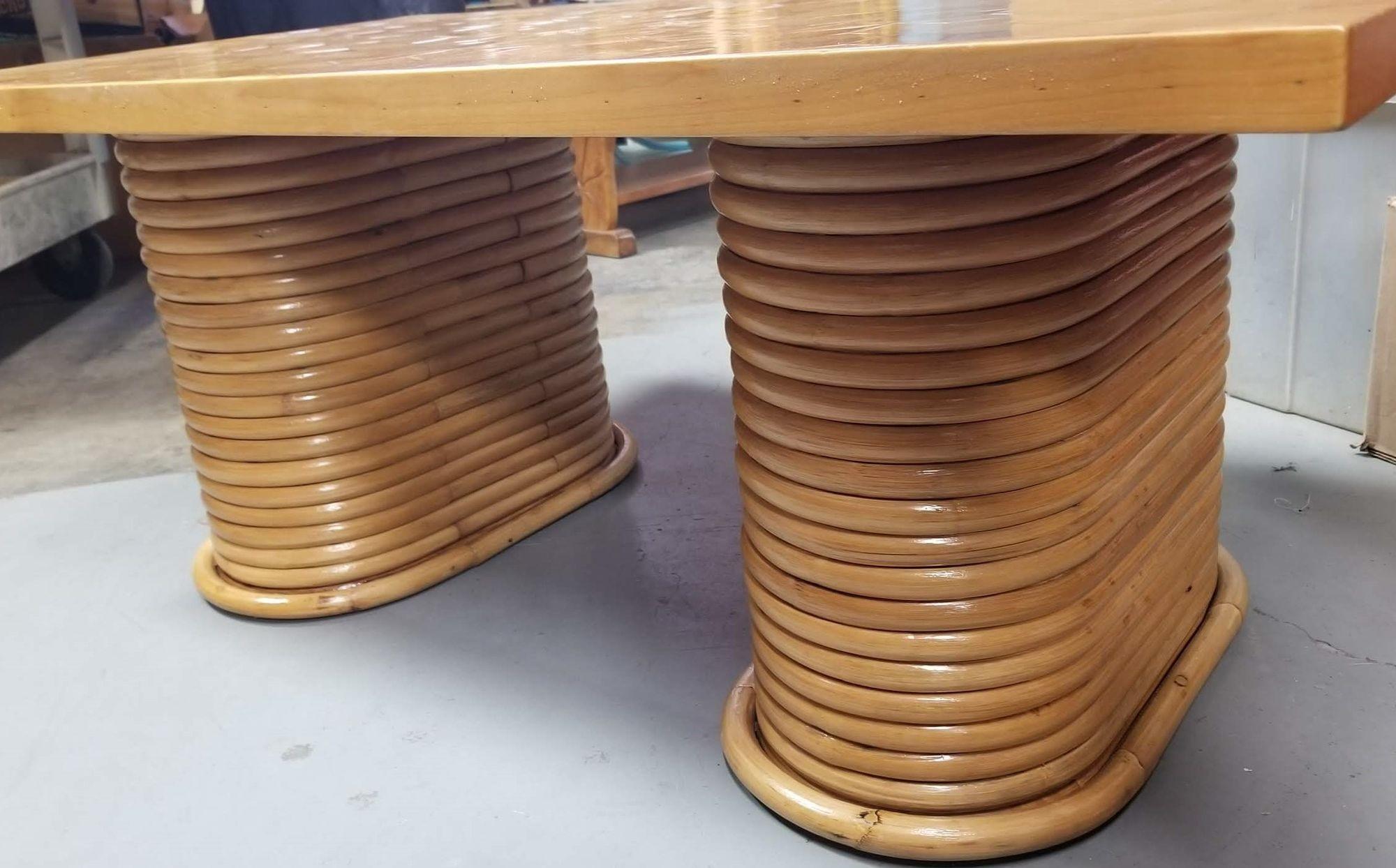 Beautifully restored rattan coffee table featuring a unique cube cut pattern top and stacked pedestal legs.

We only purchase and sell only the best and finest rattan furniture made by the best and most well-known American designers and