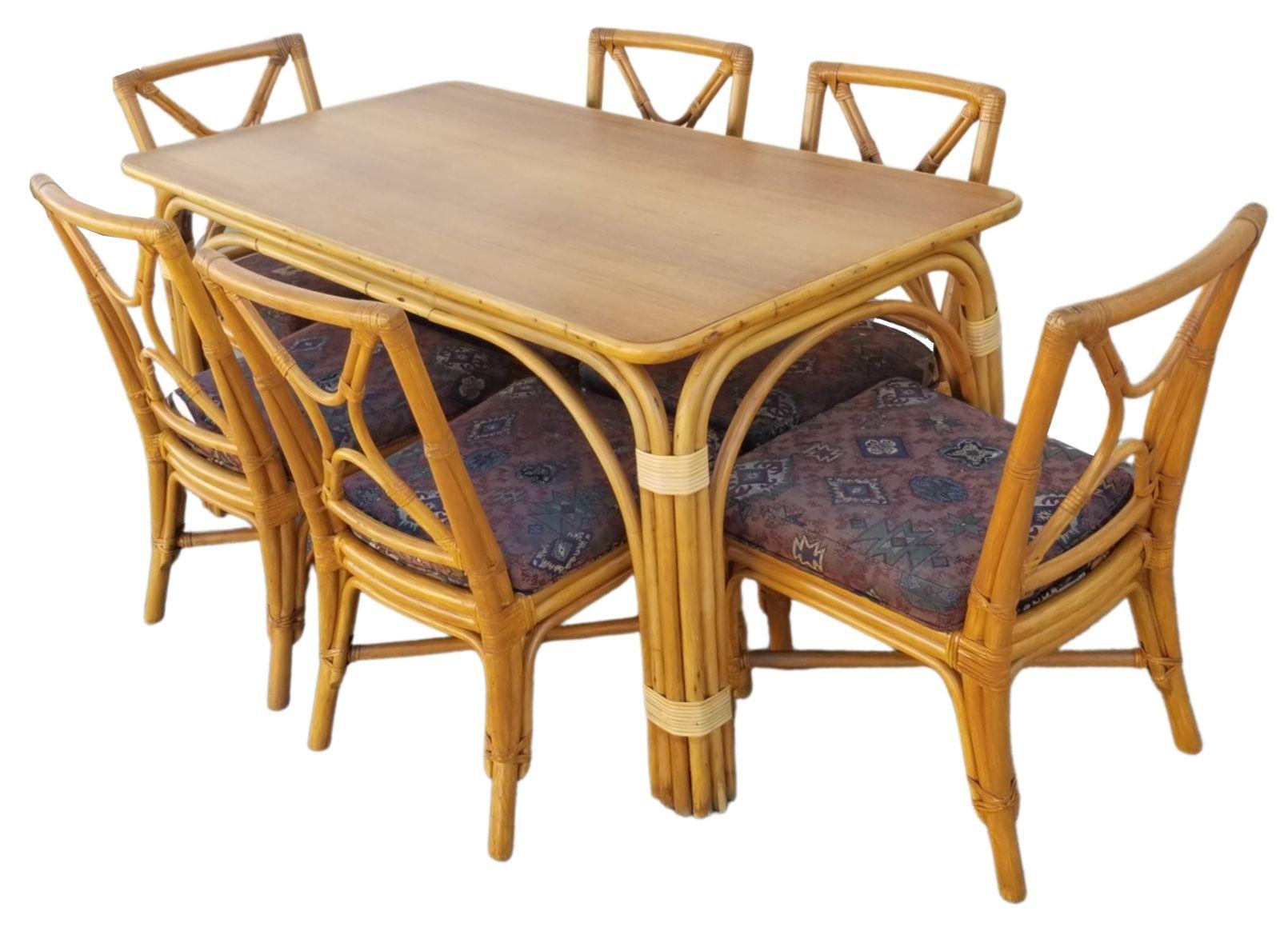 Restored rattan dining set featuring a six-strand arch legged dining table with Mahogany look Formica top and six X-Back chairs.

Dimensions:
Table: H 29
