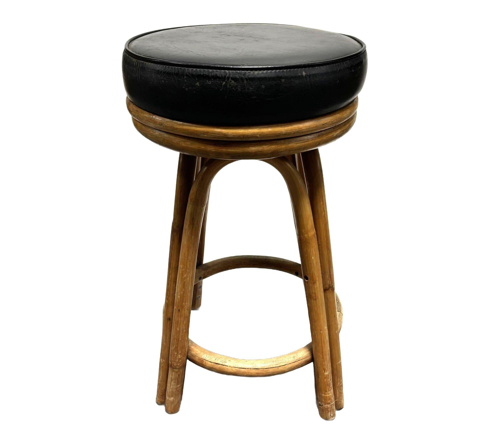 Restored Rattan Double Stand Arched Barstool w/ Black Naugahyde seat, Pair In Excellent Condition For Sale In Van Nuys, CA