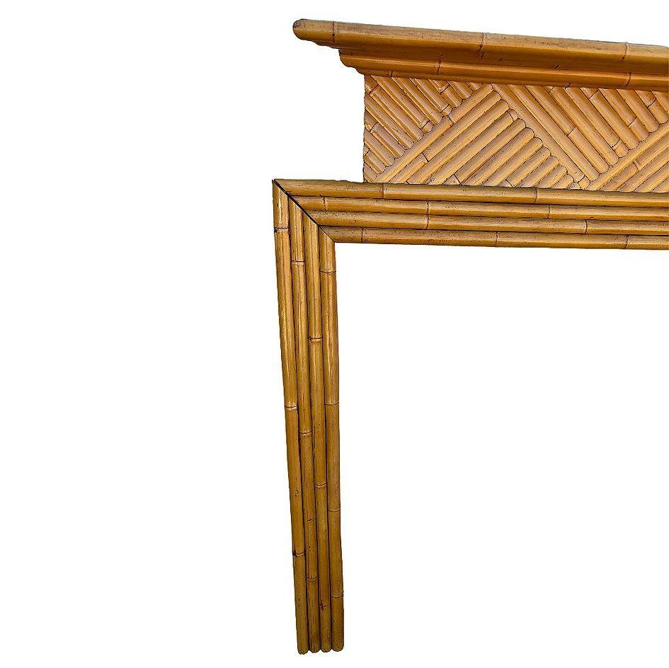 Transform your space with this restored piece of Hollywood history featuring a Paul Frankl inspired rattan fireplace surround custom-made for the timeless actor Gary Cooper. The rattan mantle features a square arch made from rattan poles stacked
