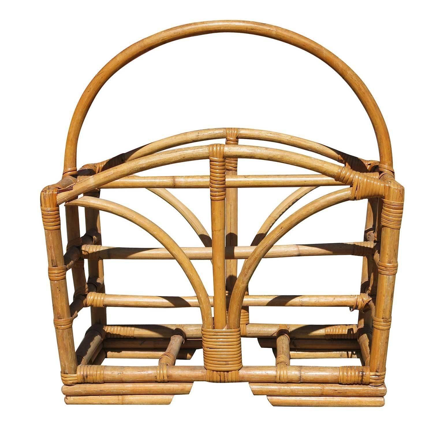Pole rattan magazine rack with stacked base and sprouting side decoration.
1950, United States
Restored to new for you.
We only purchase and sell only the best and finest rattan furniture made by the best and most well-known American designers