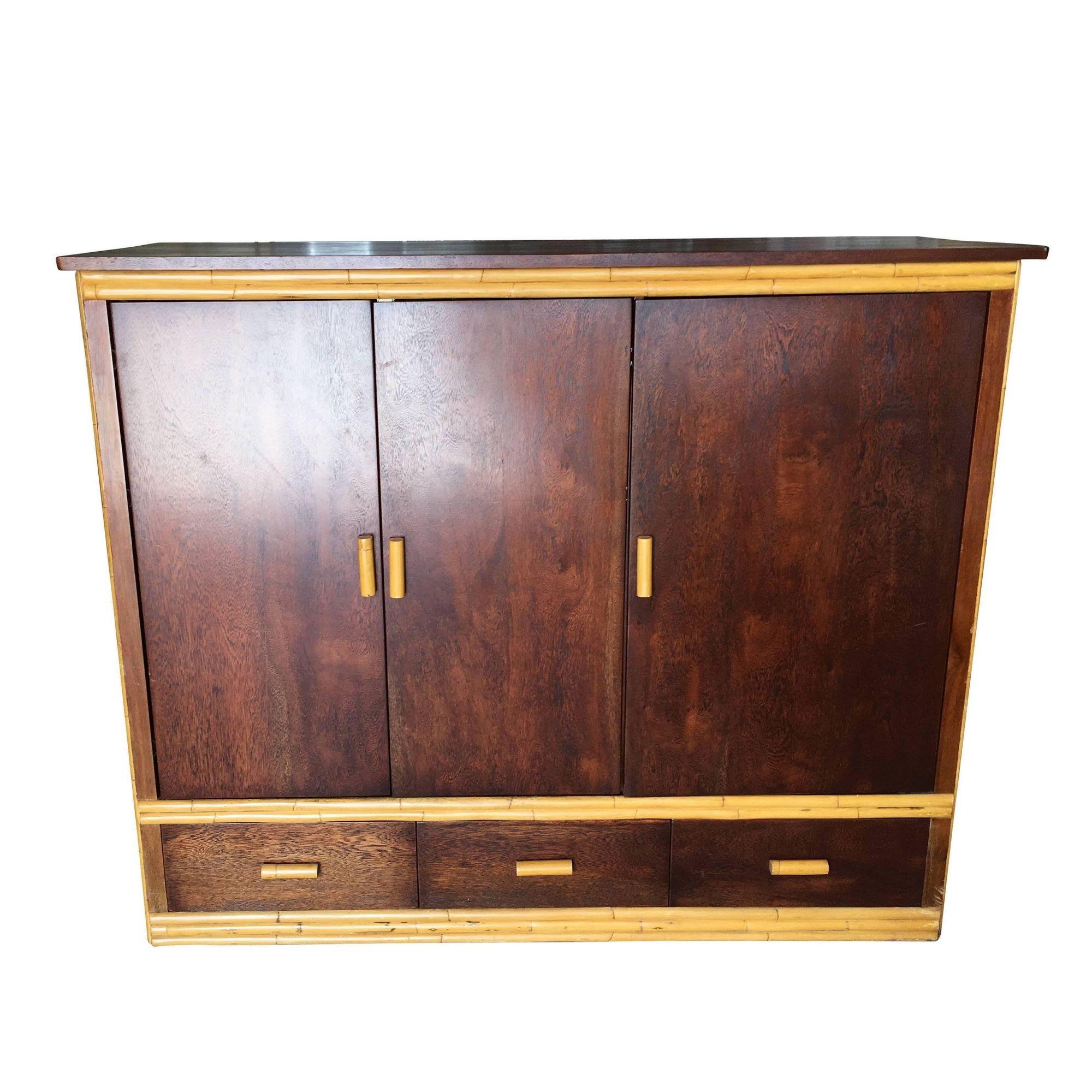 Large rattan and mahogany TV cabinet made with hideaway sliding doors, storage drawers, and adjustable component shelves. This cabinet opens with a middle TV shelf and an additional side component rack with six adjustable shelves for a Roku, DVD,
