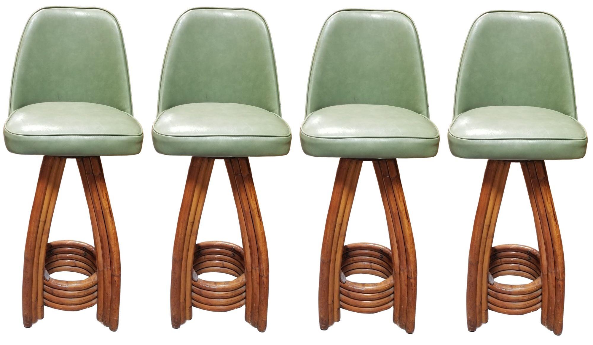 Revitalize your space with the timeless charm of an authentic Paul Frankl set made in 1936.

Meticulously restored, these four rattan bar stools showcase distinctive three-strand legs and a stacked rattan footrest base. The Avocado Green Naugahyde