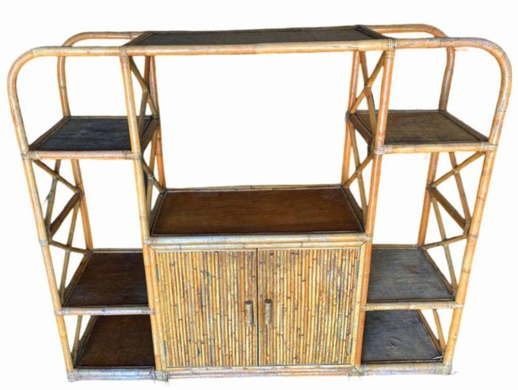 Mid-century Paul Frankl-style seven-level rattan shelf room divider wall with mahogany shelving. The unit features a unique broken-up seven-level shelf design with a two-level cabinet in the center featuring modernist 