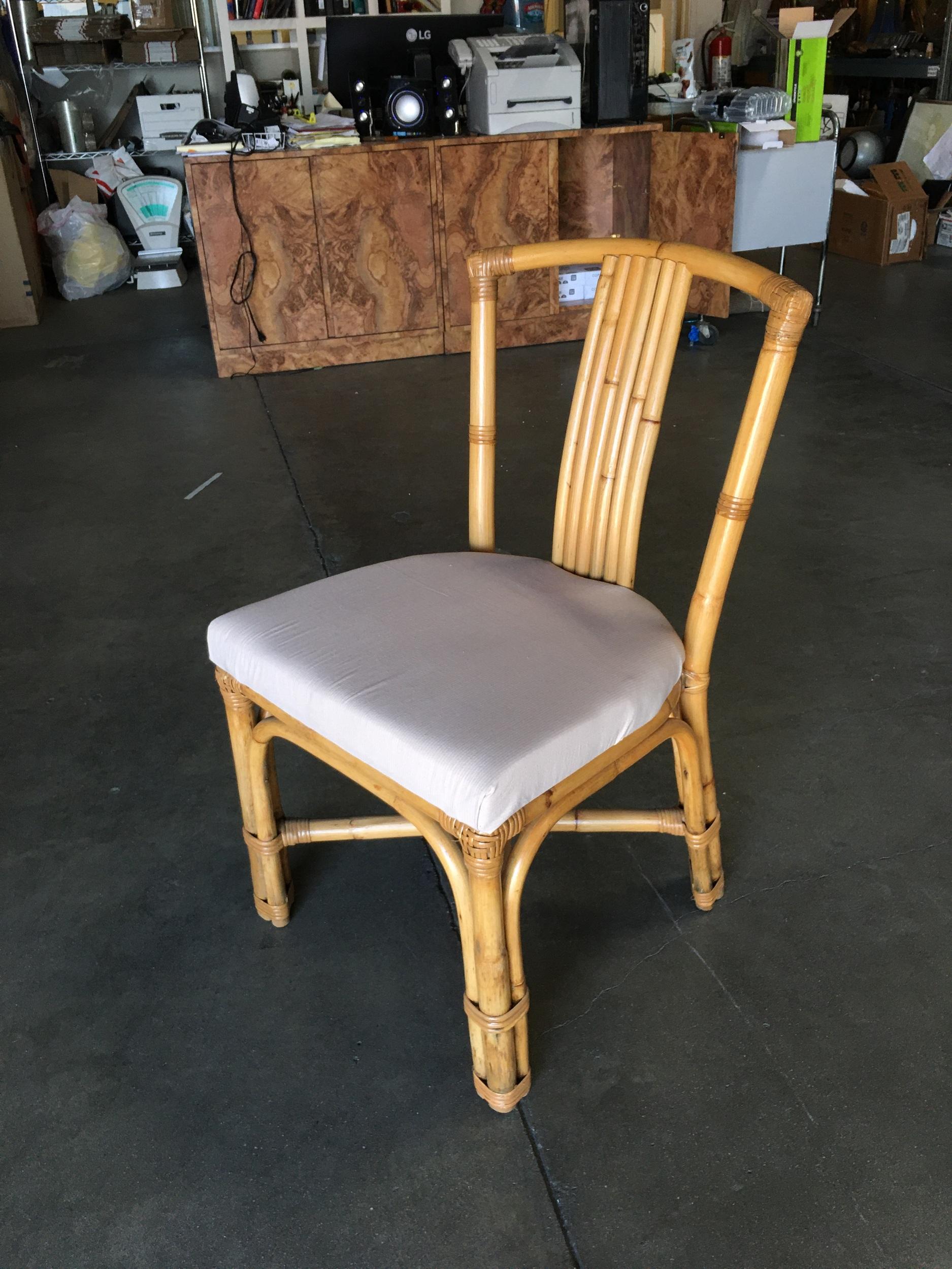 Vintage rattan side chair, the chair features a 6 strand seat back and white cotton fabric foam padded seat. Restored to new for you. All rattan, bamboo and wicker furniture has been painstakingly refurbished to the highest standards with the best