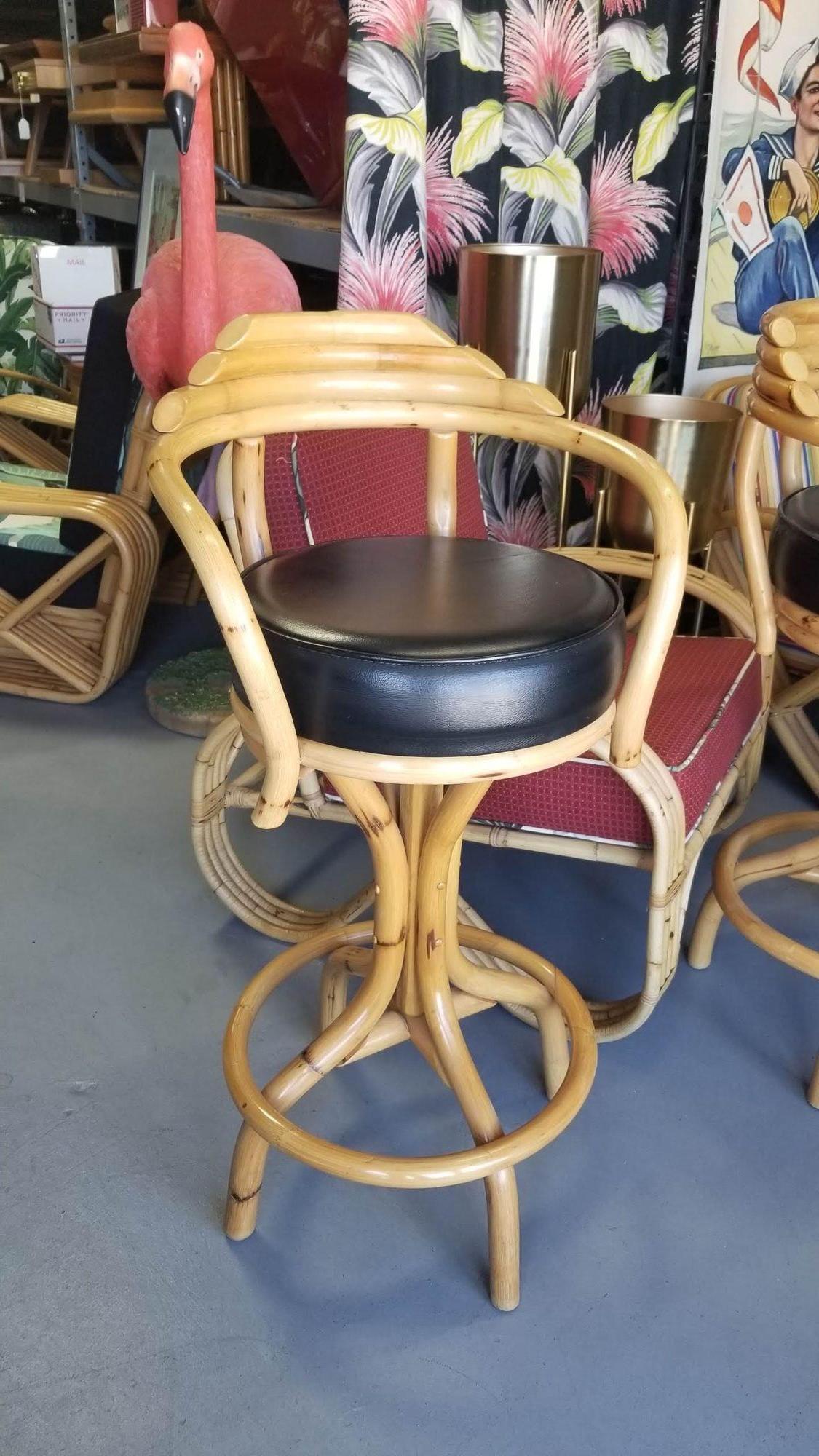 Upgrade your bar area with this charming set of three Restored Single-Strand Rattan Bar Stools. These vintage beauties feature stacked pyramid backs, offering a blend of style and comfort. With their restored allure, they make for a delightful