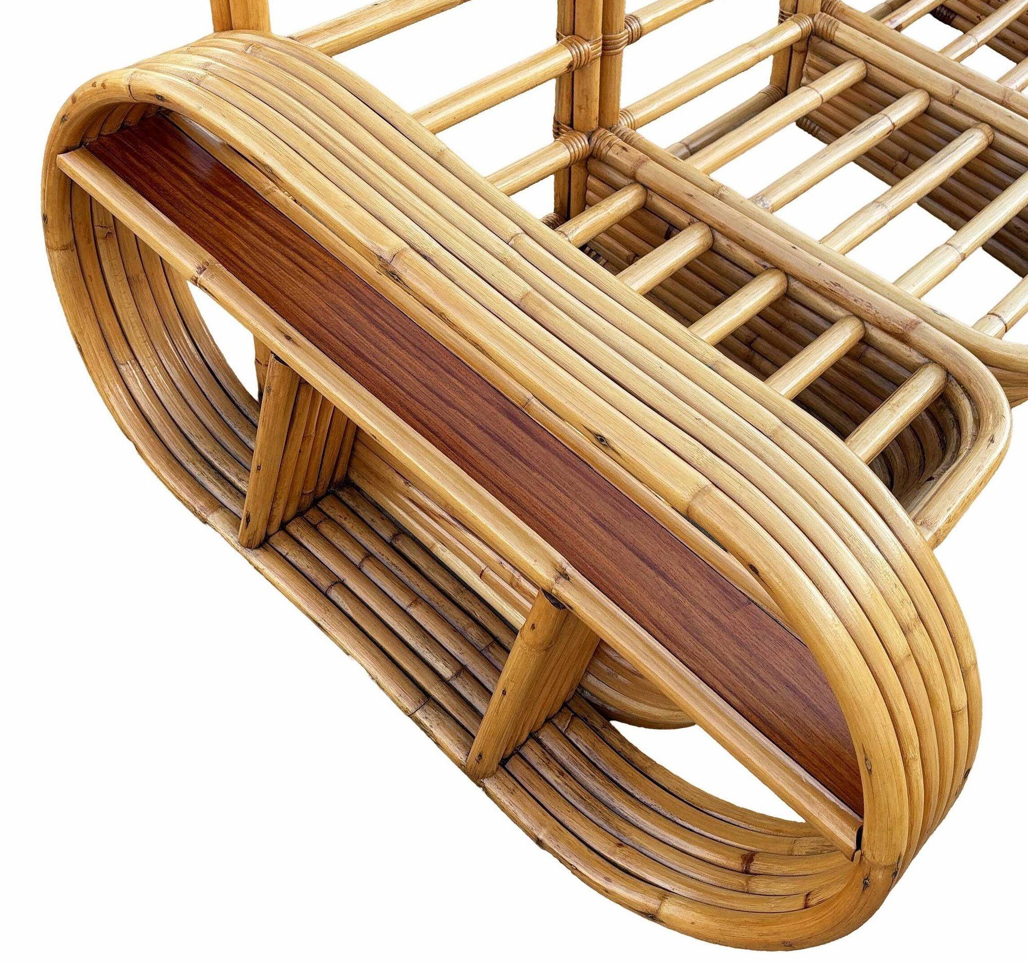 This beautifully restored Paul Frankl style rattan blends style and vintage charm with modern comfort. This stunning set features a four-seat sofa and matching lounge chair, all expertly restored to their original glory. The six-strand rattan pole