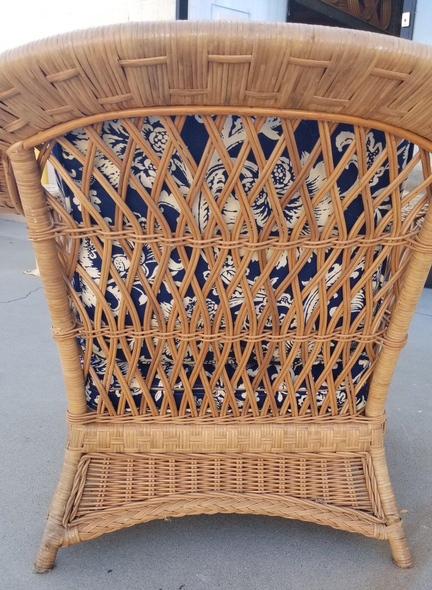 This restored rattan wicker lounge chair is a stunning piece of furniture with intricate lattice woven sides. It's timeless design exudes vintage charm and comfort, making it an ideal addition to any home or outdoor space.

Included in the price is