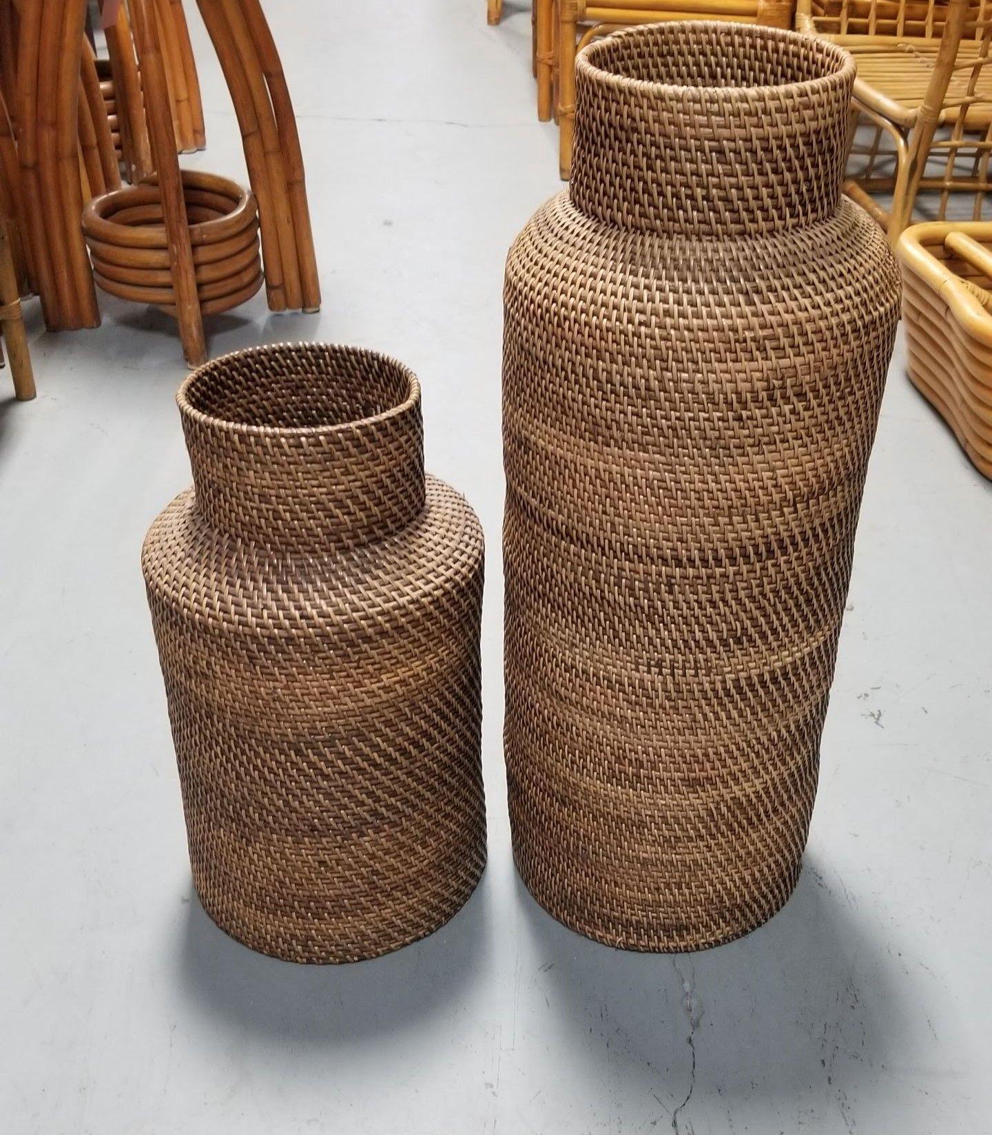 Pair of two Gabriella Crespi-styled decorative floor vases made from stacked reed pencil rattan rings with wicker weave. Perfect for holding dried plant arrangements or simply standing on its own.

Dimensions:

Smaller Vase: 19.5