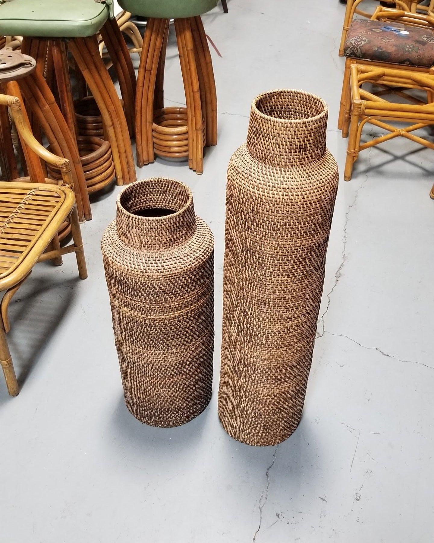 Large pair of two Gabriella Crespi-styled decorative floor vases made from stacked reed pencil rattan rings with wicker weave. Perfect for holding dried plant arrangements or simply standing on its own.

Dimensions:

Smaller Vase: 29