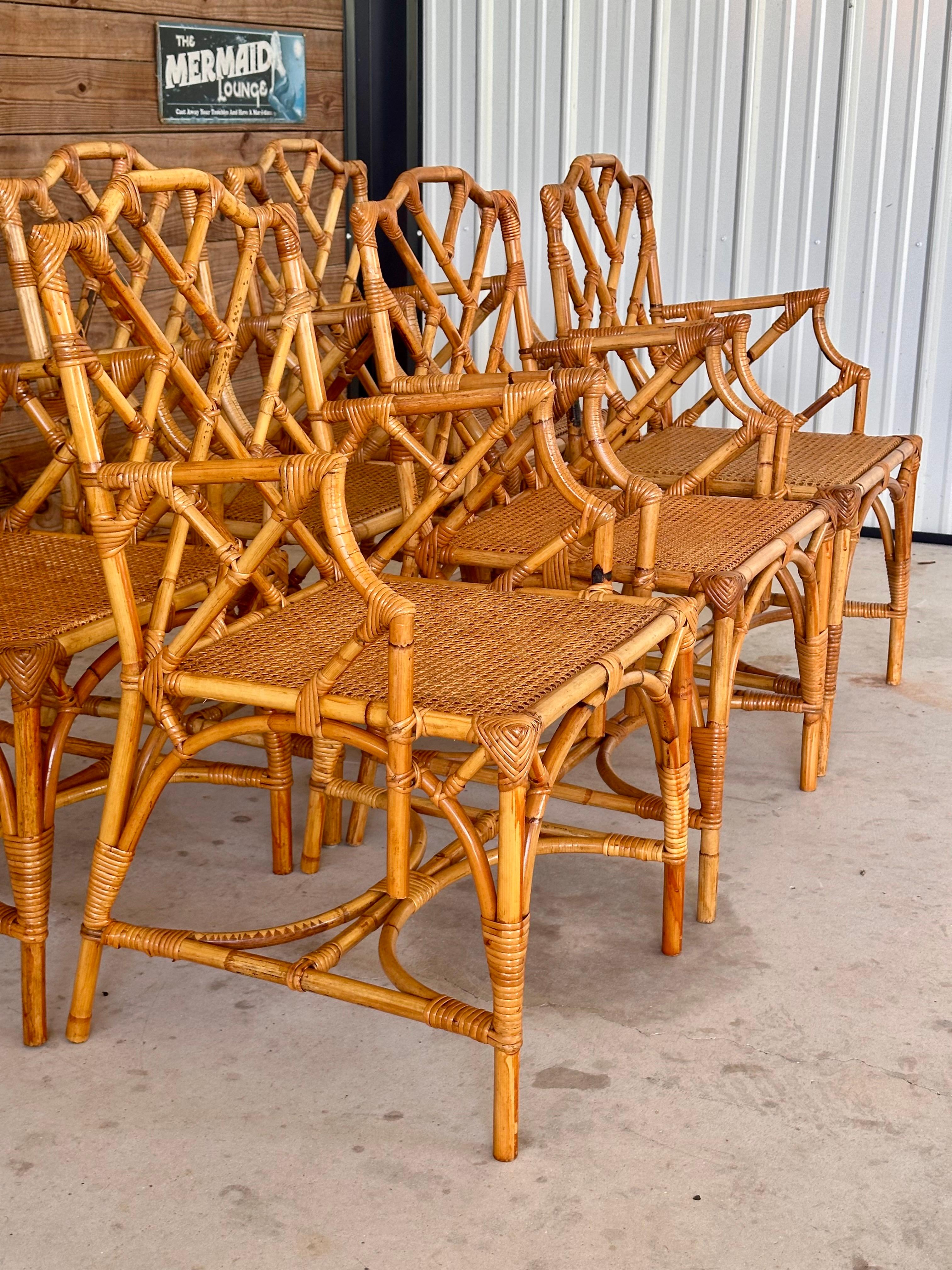 Embrace the elegance of mid-20th century design with this exquisite set of six rattan dining chairs, crafted in Italy during the 1950s.
Each chair showcases the timeless Chippendale style, characterized by intricate fretwork and graceful lines.
