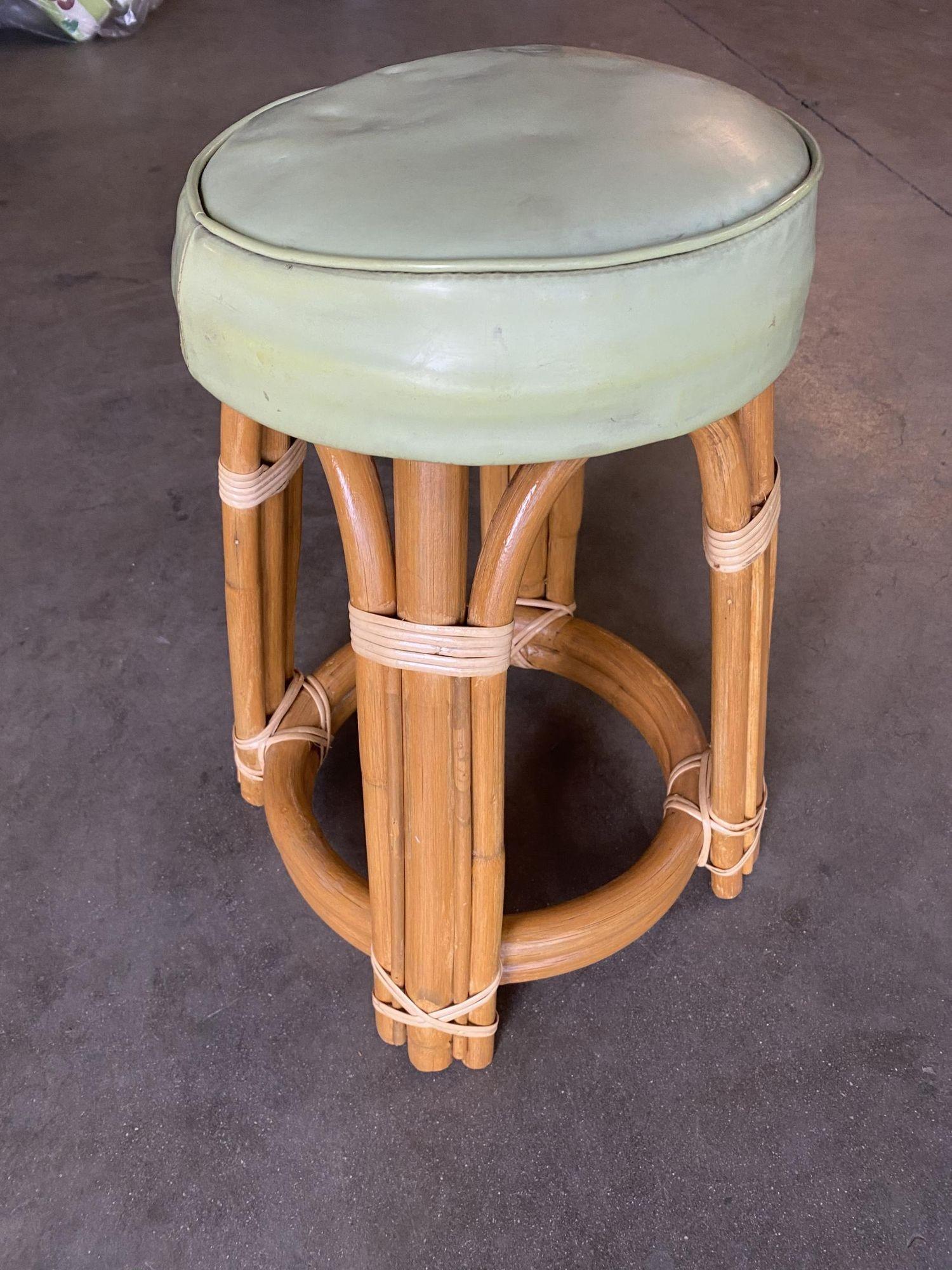 Restored Mid-century single stand arched rattan vanity stool with teal vinyl seat

1950, United States

We only purchase and sell the best and finest rattan furniture made by the best and most well-known American designers and manufacturers