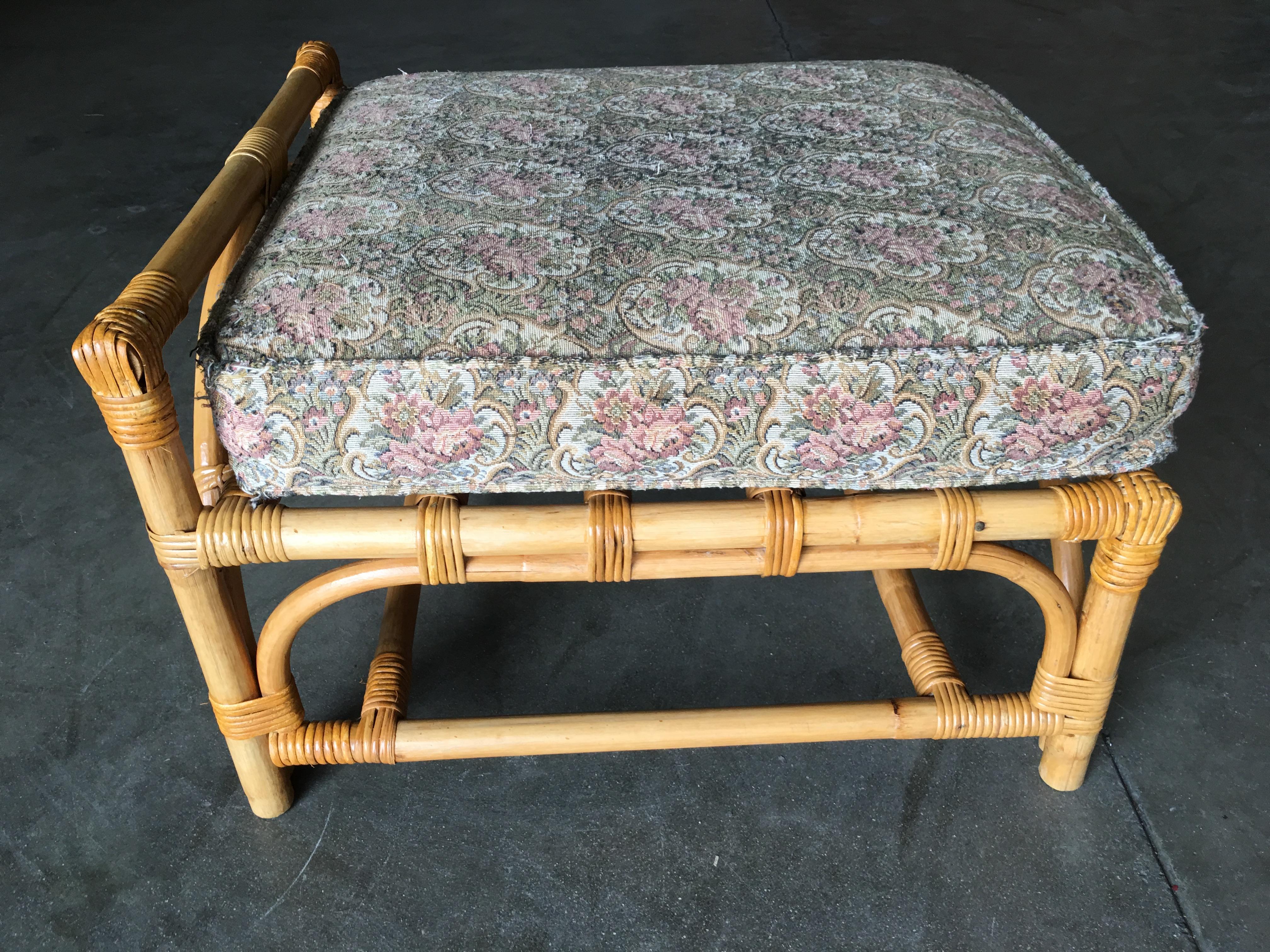 Fully restored single stand rattan triple-arched ottoman stool with a front handrail. The ottoman features fancy wicker wrappings through out.

Custom cushions C.O.M. (Customers Own Material) are included in the price. Simply supply the fabric and