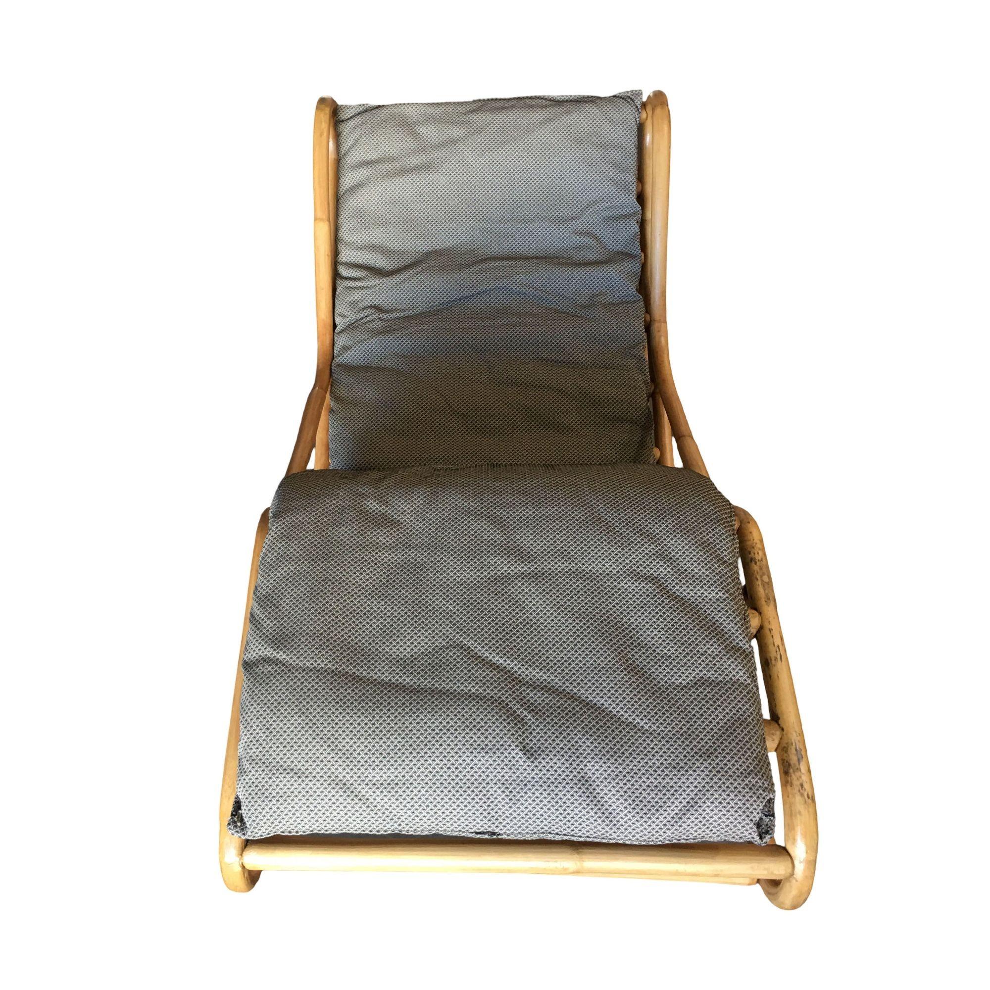 Restored single-strand rattan chaise lounge chair which rocks into two fixed positions for extra comfort, includes new cushions.

Custom cushions are included in the price, simply supply the fabric and we have the cushions made for you. If you need