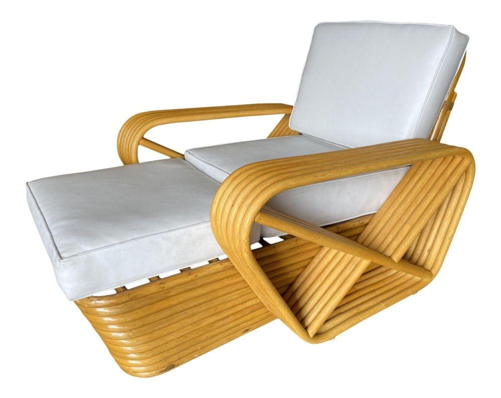Designed in the manner of Paul Frankl, this six-strand, rattan chaise longue chair features square pretzel arms and a Classic stacked base.