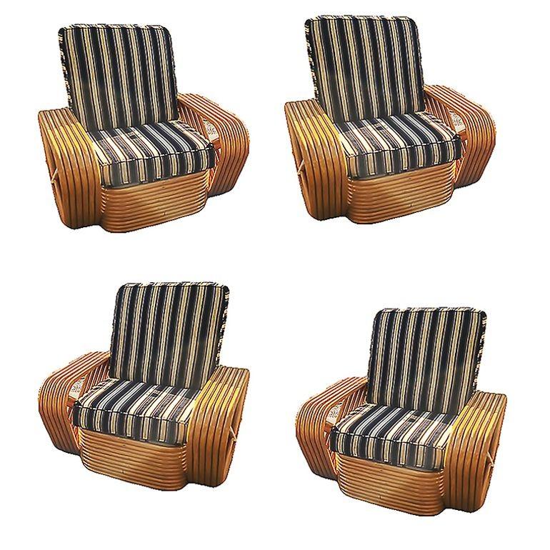 Set of 4 six-strand rattan lounge chairs designed in the manner of Paul Frank features square pretzel arms and the classic stacked rattan base. 

1950, United States

We only purchase and sell only the best and finest rattan furniture made by the