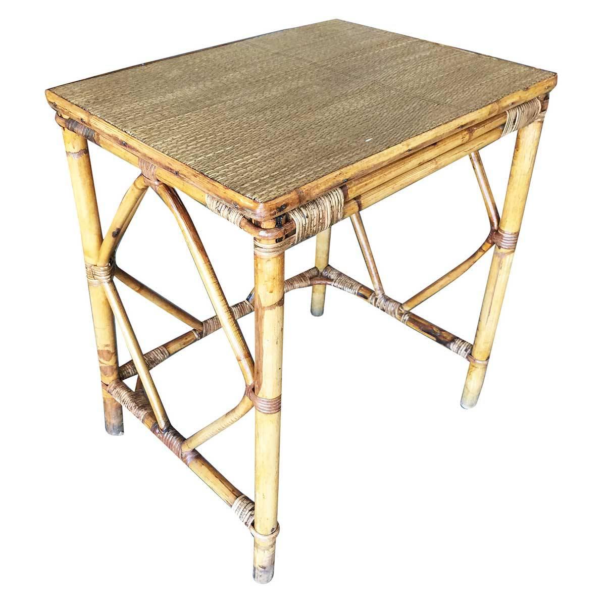 Simply yet elegant small rattan side table with steam pressed diamond shaped sides and rice mat top. The table features Classic wicker wrappings and Mid-Century appeal,

circa 1950.

Restored to new for you.

All rattan, bamboo and wicker furniture