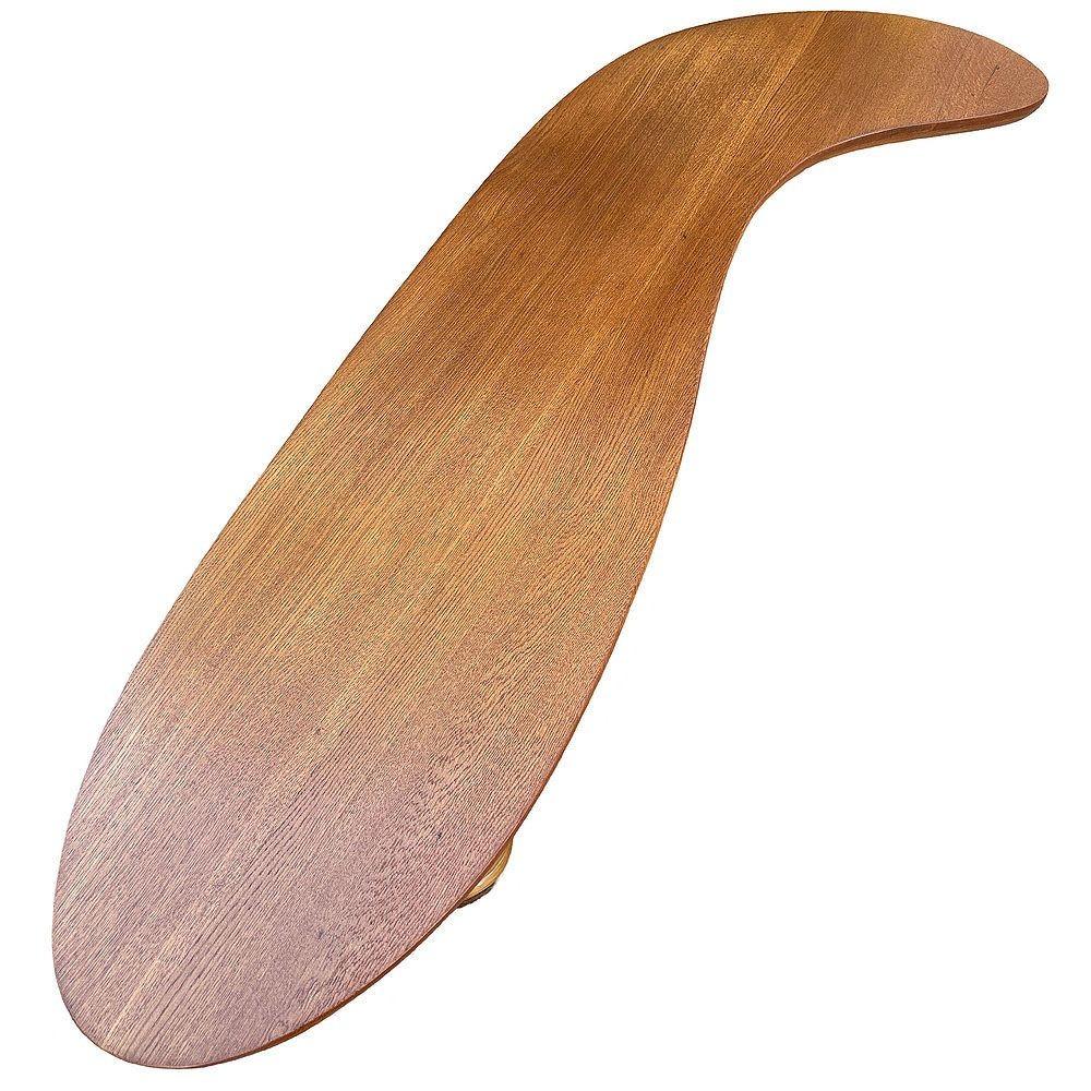 This beautifully restored biomorphic rattan table has a striking Paul Frankl-inspired mid-century design. It features two stacked bases and a dark-stained Koa Wood top. This blend of materials adds depth and dimension, enhancing its organic