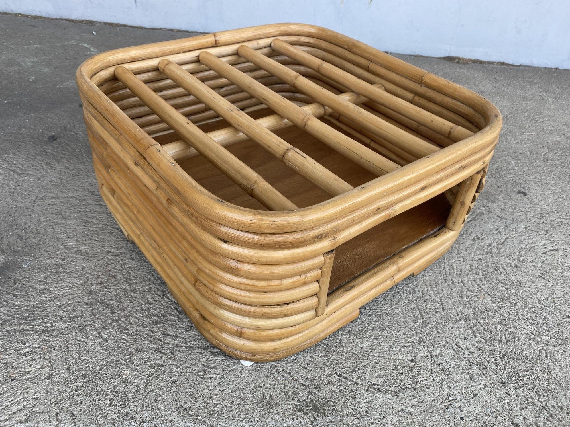 Fully restored stacked rattan ottoman footrest with underneath cubby space for magazines and other living room items. The ottoman features a cross bar top and a mahogany floor in the cubby space.
1950, USA

Included in the price is a custom choice