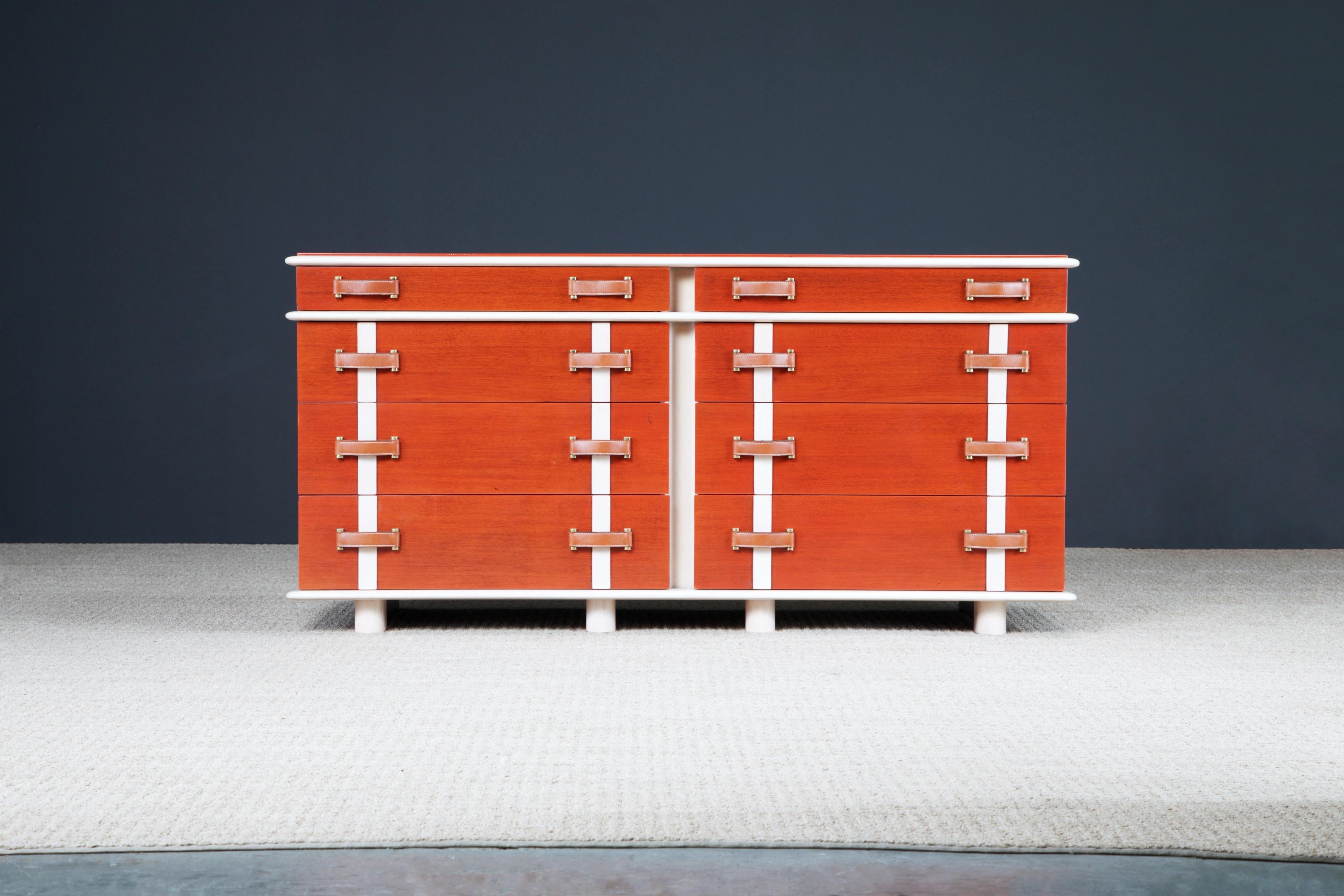 This rare collectors ten-drawer dresser is by Paul T. Frankl for Johnson Furniture, circa 1945, from the 'Station Wagon' series of bedroom furniture. Beautifully contrasting Mahogany and Maple refinished with a beautiful French Polish. Fully signed