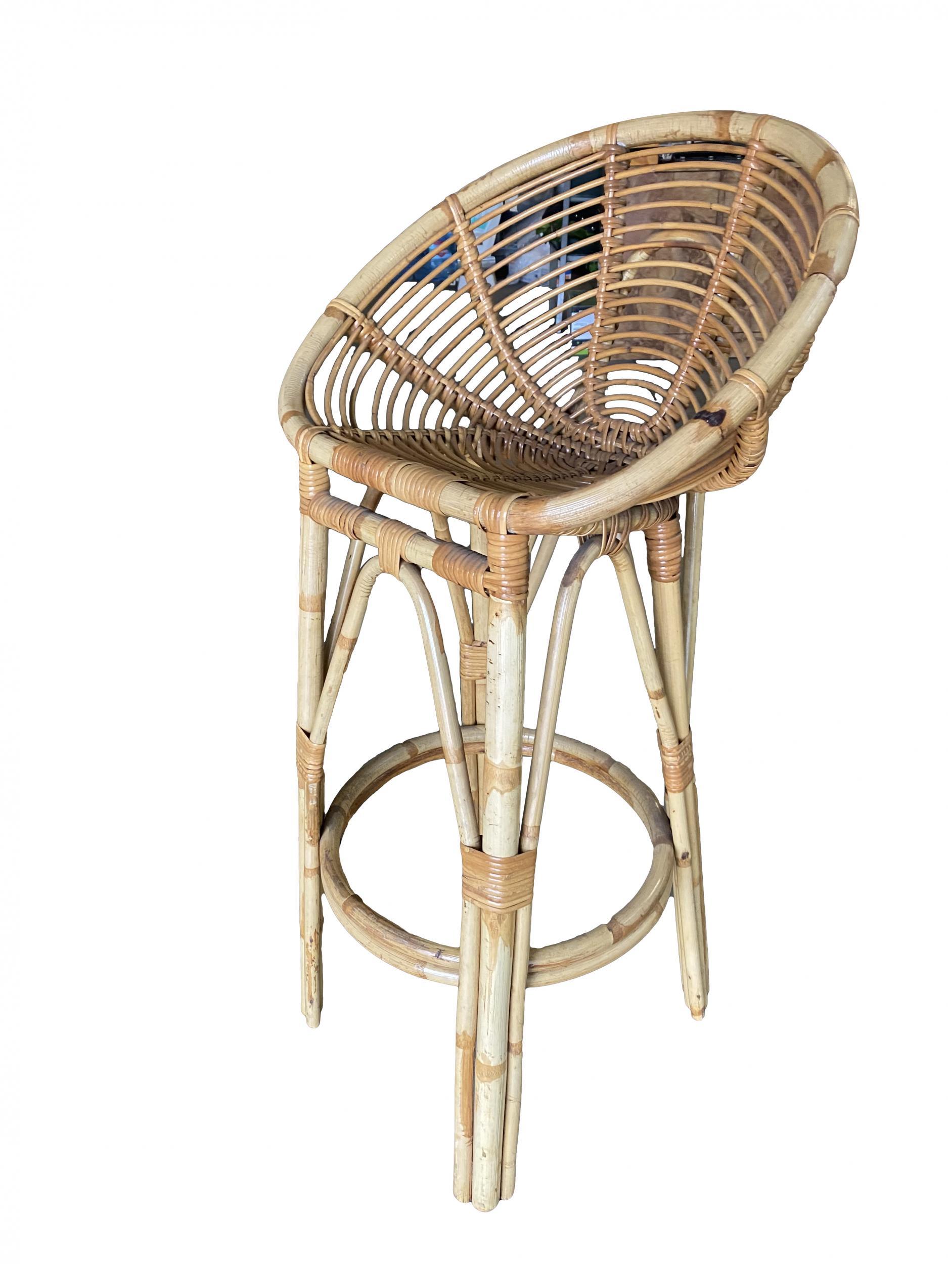Restored pair of stick rattan bar stools in the manner of Albini featuring a spiraling stick rattan seat with pole rattan legs.