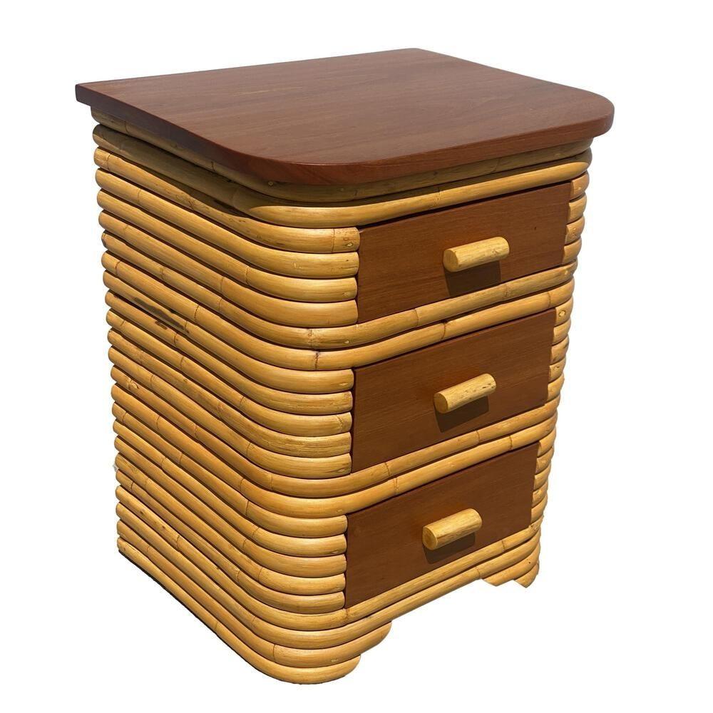 Pair of Streamline Art Deco Stacked Rattan Bedside Table with Mahogany top featuring 3 drawers each made of solid Mahogany with a rattan pull.

1930, United States

We only purchase and sell only the best and finest rattan furniture made by the best
