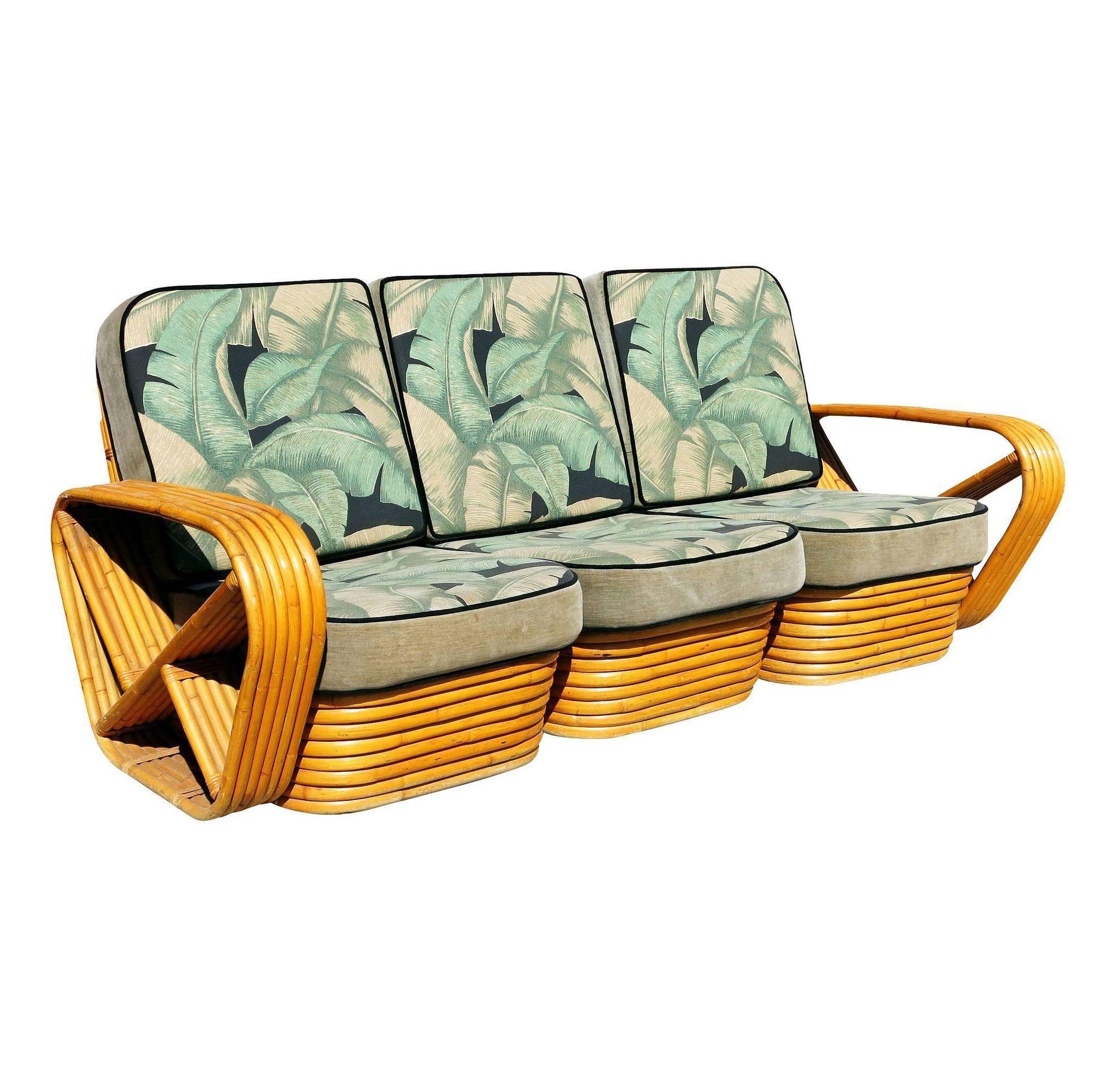 Six-strand square Pretzel style, three-seat sectional sofa. This sofa set of two features the famous six strand square pretzel side arms and stacked rattan base. The seats are covered in palm leaf patterned barkcloth cushions. 

Measures:
Sofa:
