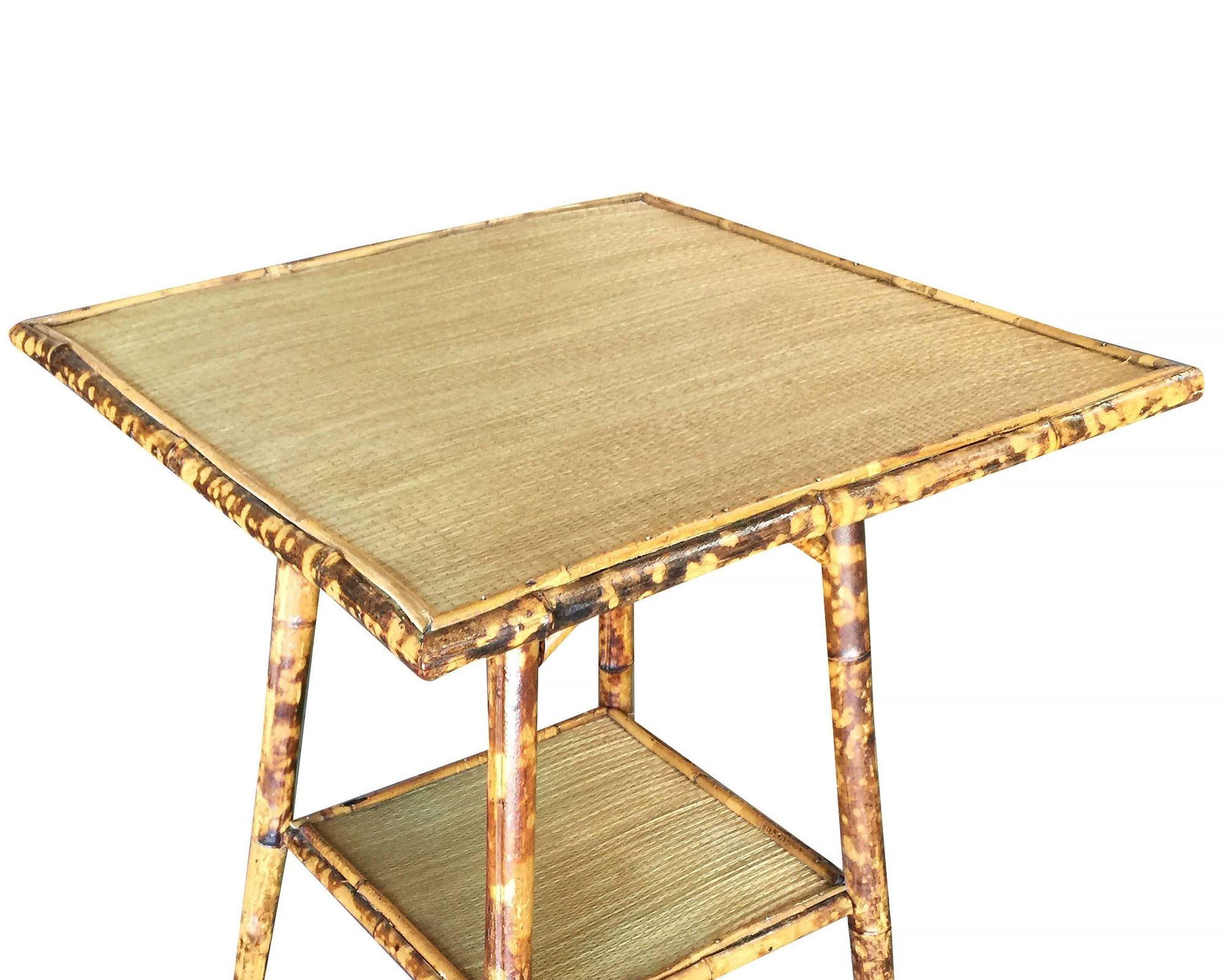 Antique tiger bamboo pedestal side table with rice mat top, large top and secondary bottom shelf.
Restored to new for you.

All rattan, bamboo and wicker furniture has been painstakingly refurbished to the highest standards with the best materials.