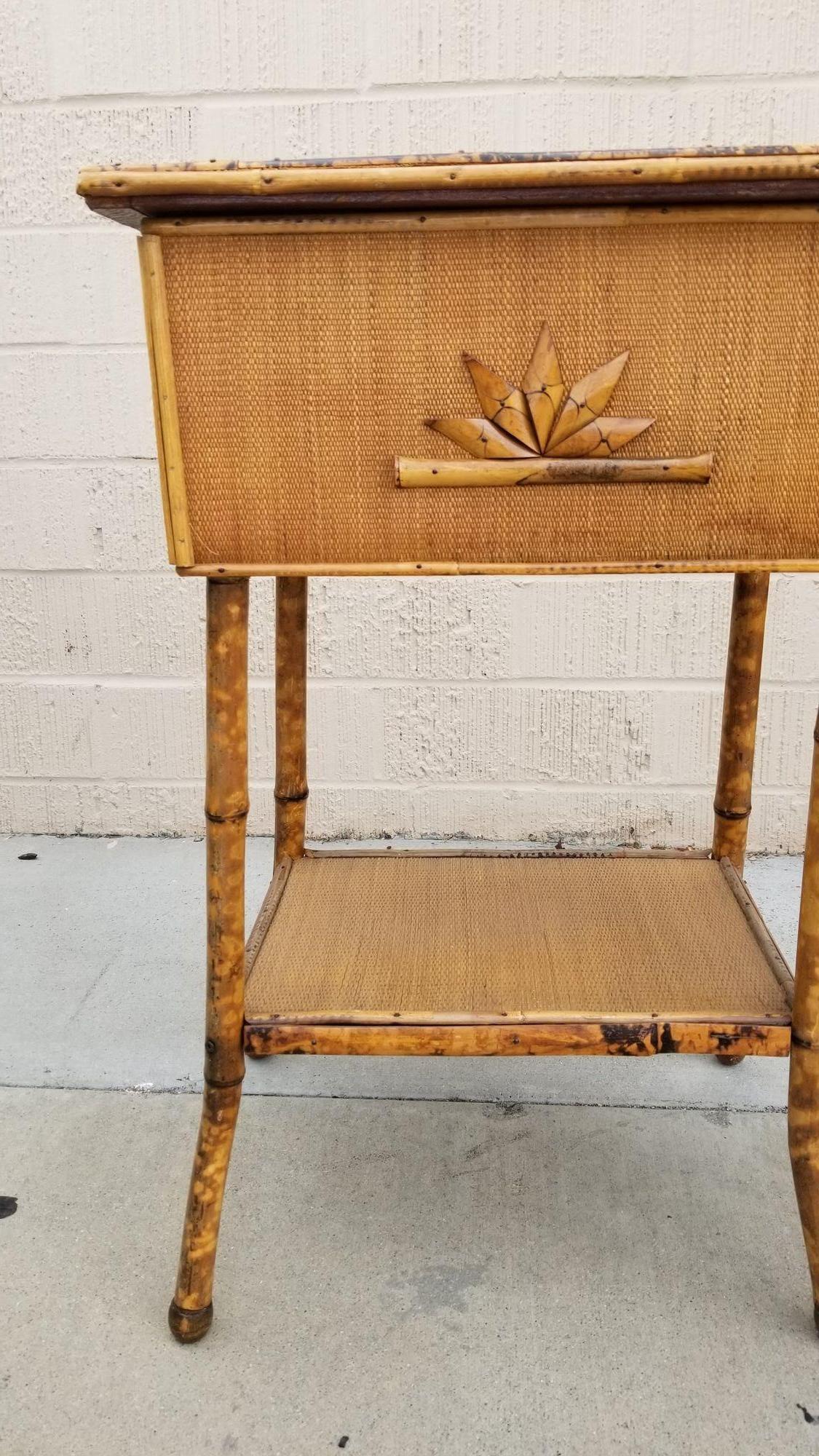 Antique tiger bamboo, also known as tortoise shell bamboo, pedestal side table with flip-open lid storage, and a secondary bottom shelf. With rice mat covering.
Restored to new for you.
All rattan, bamboo and wicker furniture has been