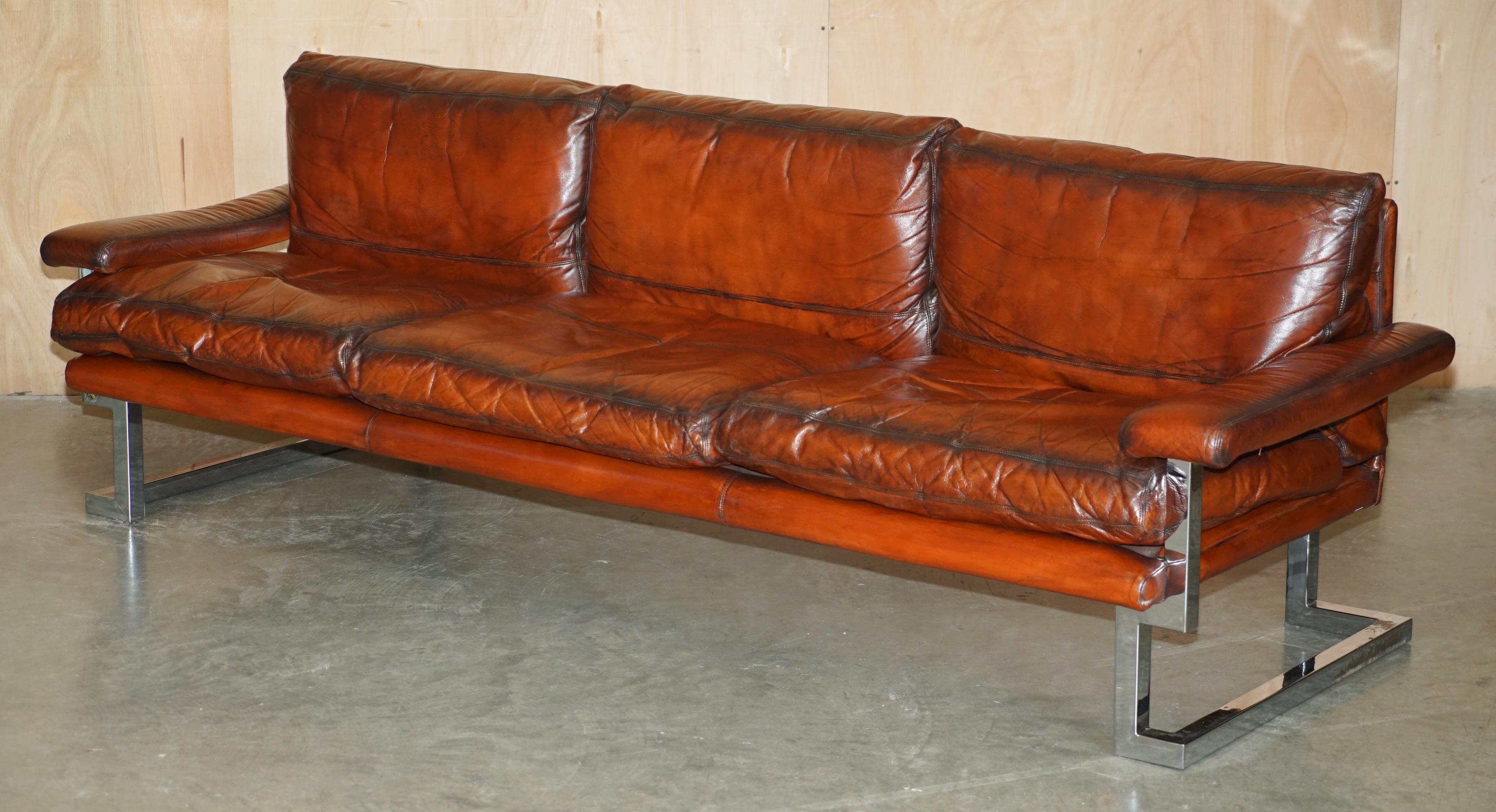 Royal House Antiques

Royal House Antiques is delighted to offer for sale this absolutely stunning, exceptionally rare, fully restored, Tim Bates for Pieff Mandarin suite in hand dyed brown leather with oversized chrome frames and a Rosewood top to